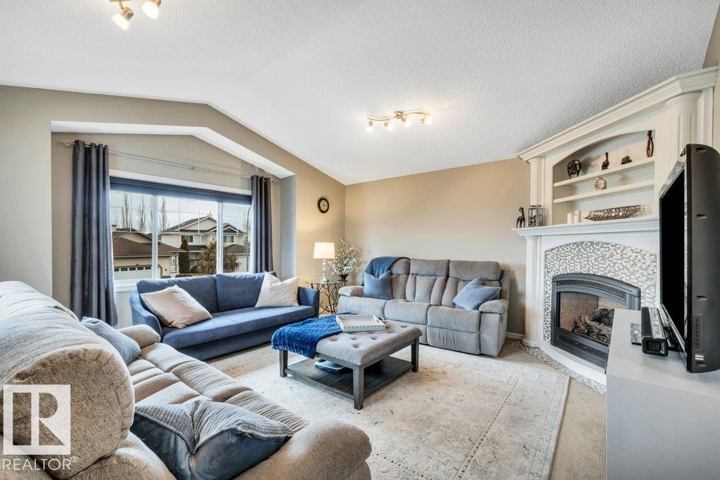 1 Rosemount, Beaumont, AB - Indoor Photo Showing Living Room With Fireplace