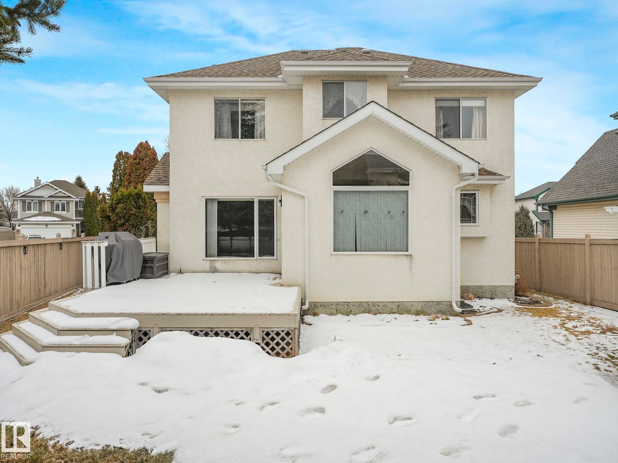 The property features a private fenced yard with a deck, offering outdoor living space - 11704 11 Avenue, Edmonton, AB - Outdoor