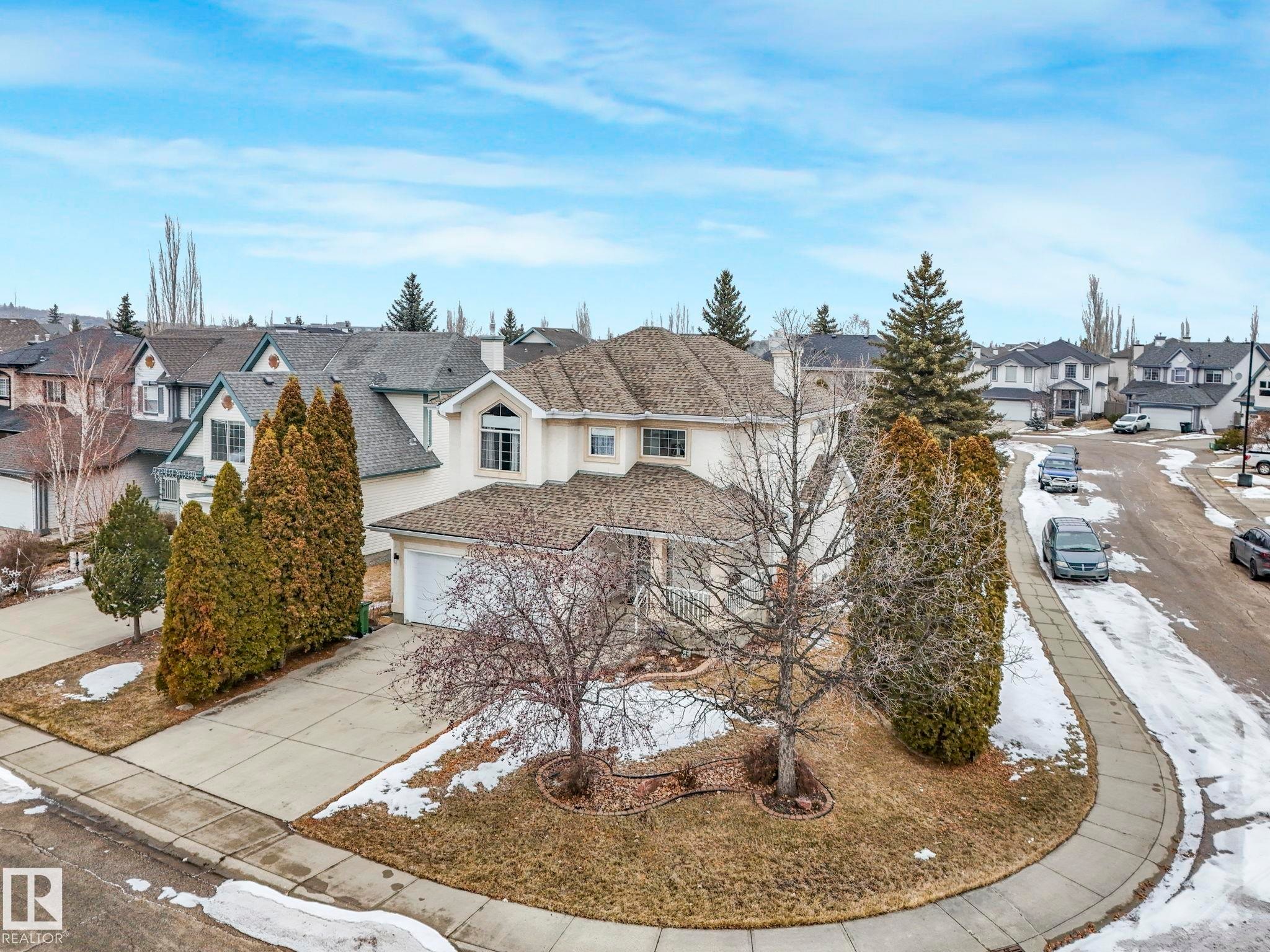 The property features a private driveway and an attached garage - 11704 11 Avenue, Edmonton, AB - Outdoor
