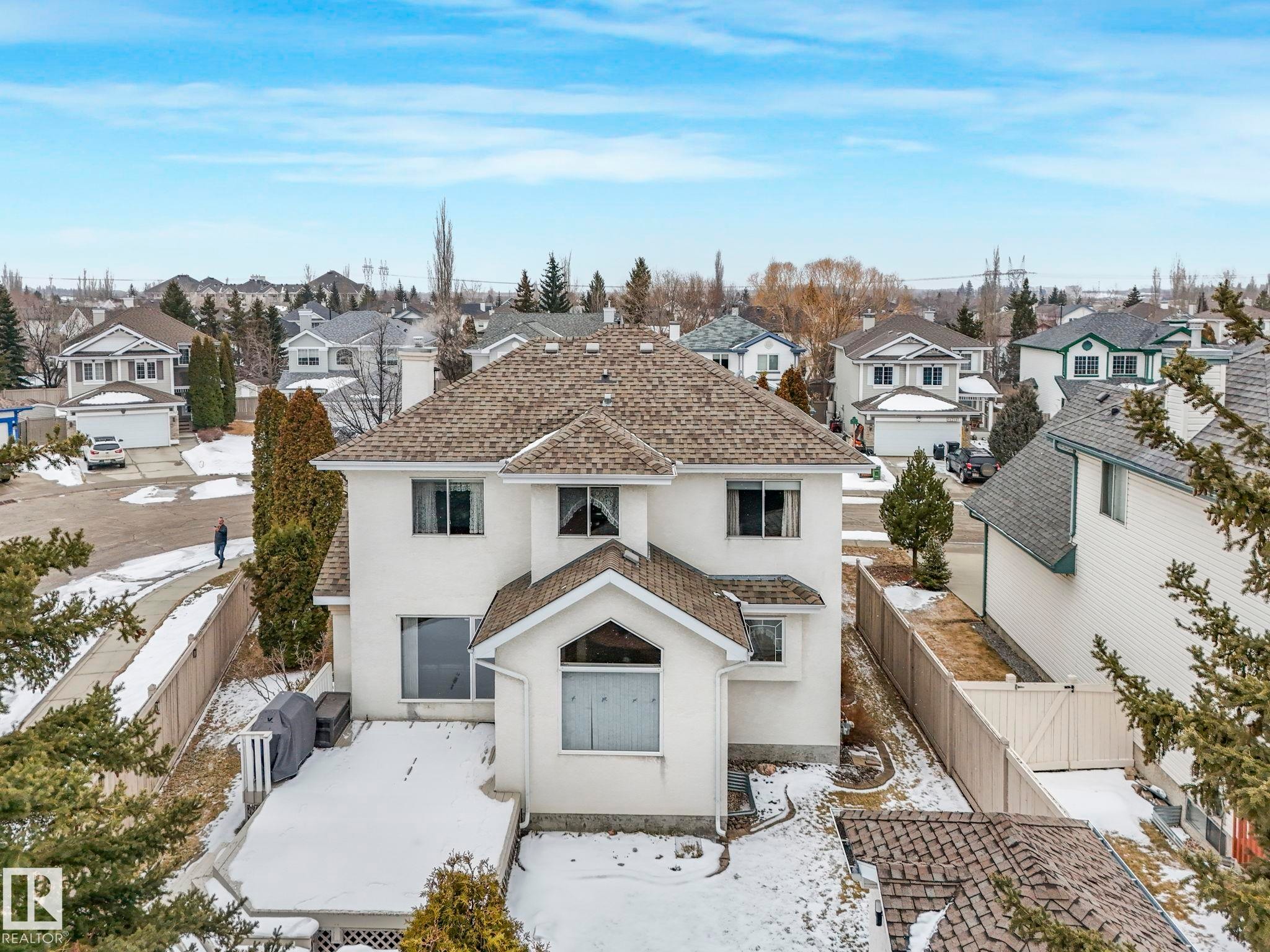 An aerial view of the property, showcasing its white exterior and shingled roof - 11704 11 Avenue, Edmonton, AB - Outdoor With Facade