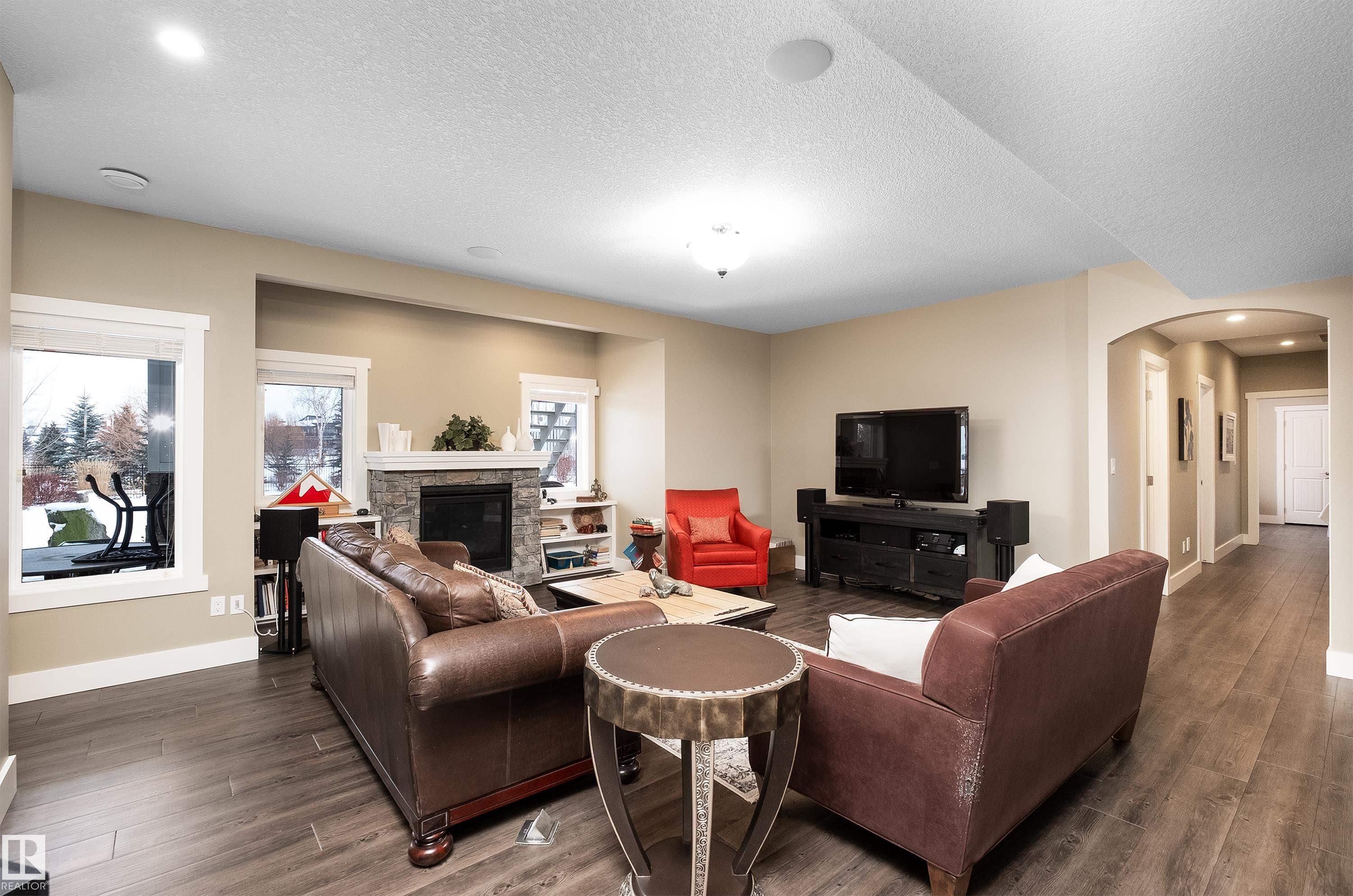 1079 Genesis Lake Boulevard, Stony Plain, AB - Indoor Photo Showing Living Room With Fireplace