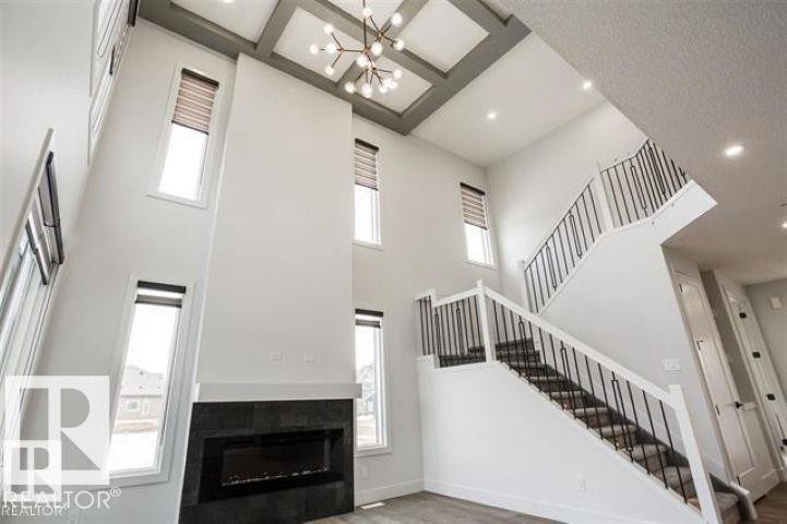 7446 Colonel Mewburn Road, Edmonton, AB - Indoor Photo Showing Other Room With Fireplace