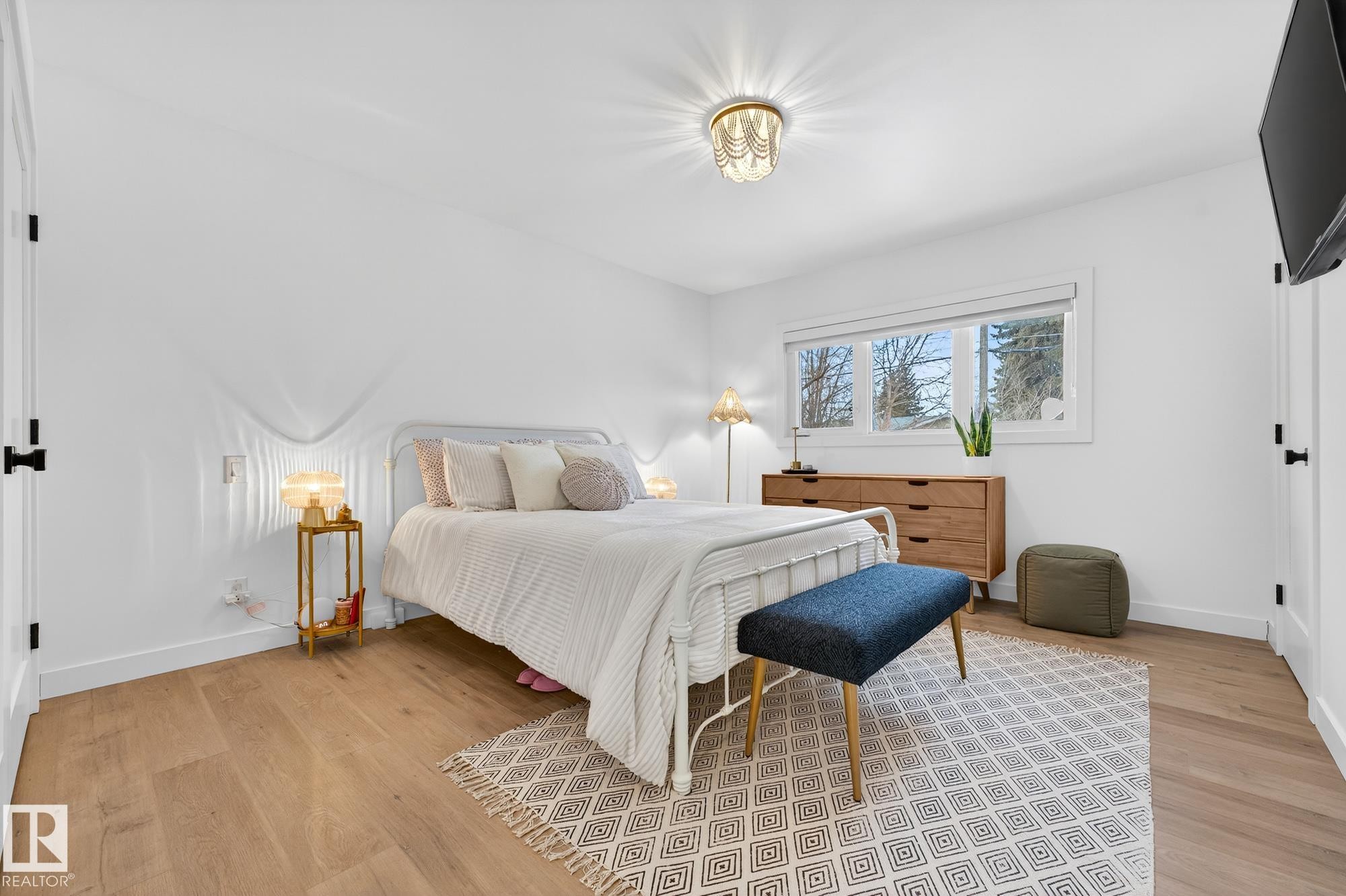 Bedroom with baseboards and light wood finished floors - 8604 142 Street, Edmonton, AB - Indoor Photo Showing Bedroom
