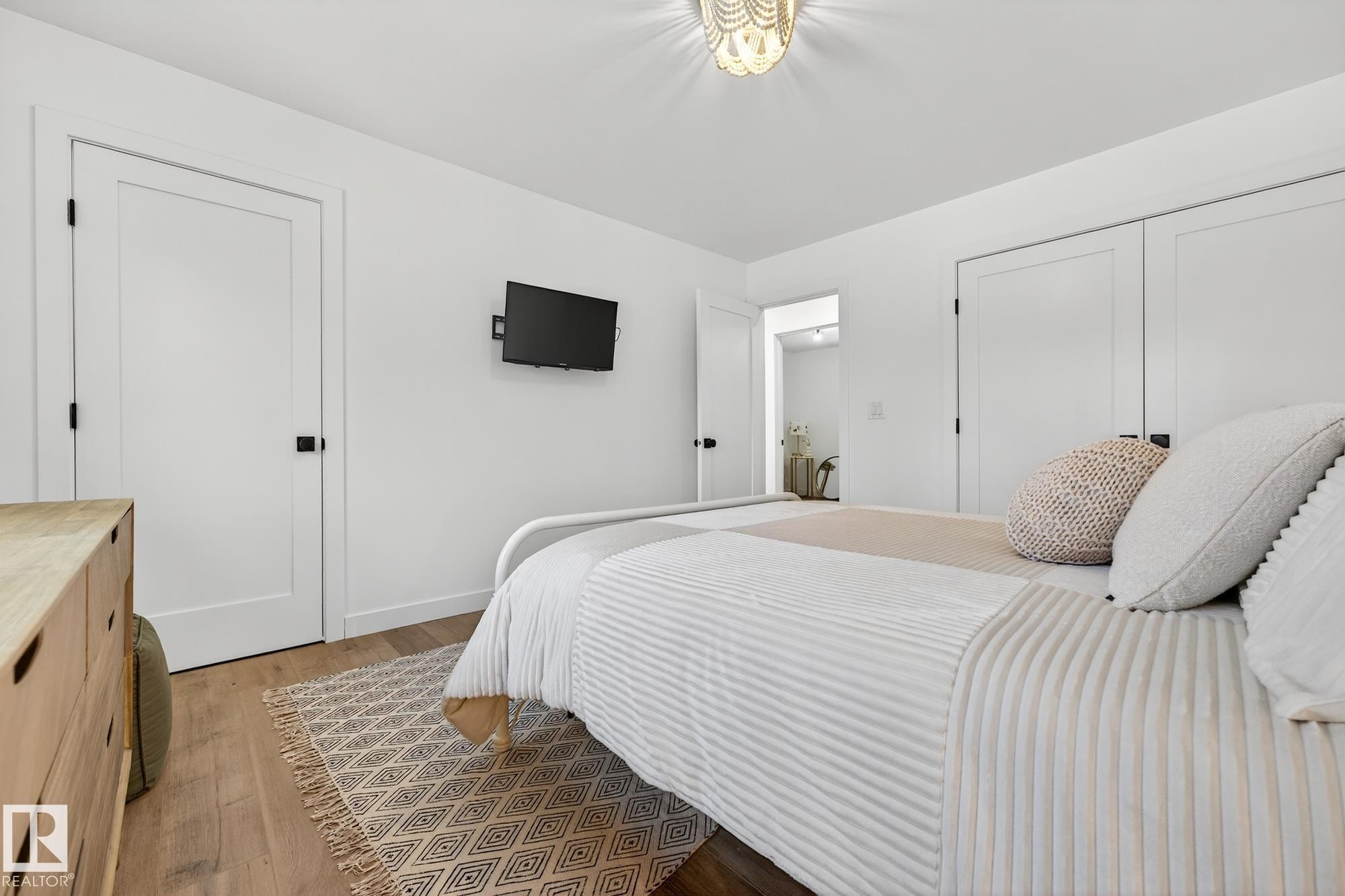 Bedroom featuring light wood-type flooring - 8604 142 Street, Edmonton, AB - Indoor Photo Showing Bedroom
