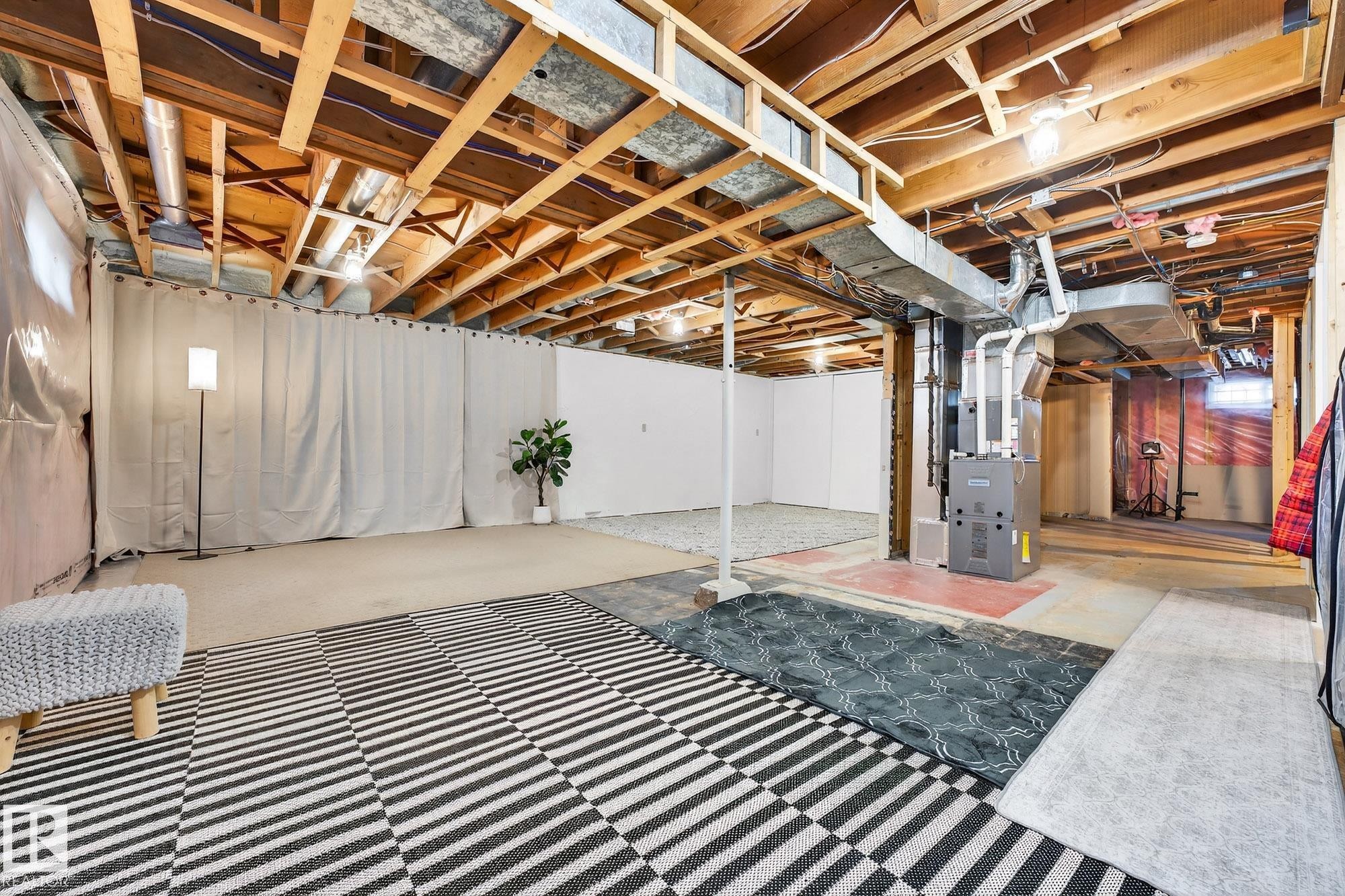 Unfinished below grade area with heating unit - 8604 142 Street, Edmonton, AB - Indoor Photo Showing Basement