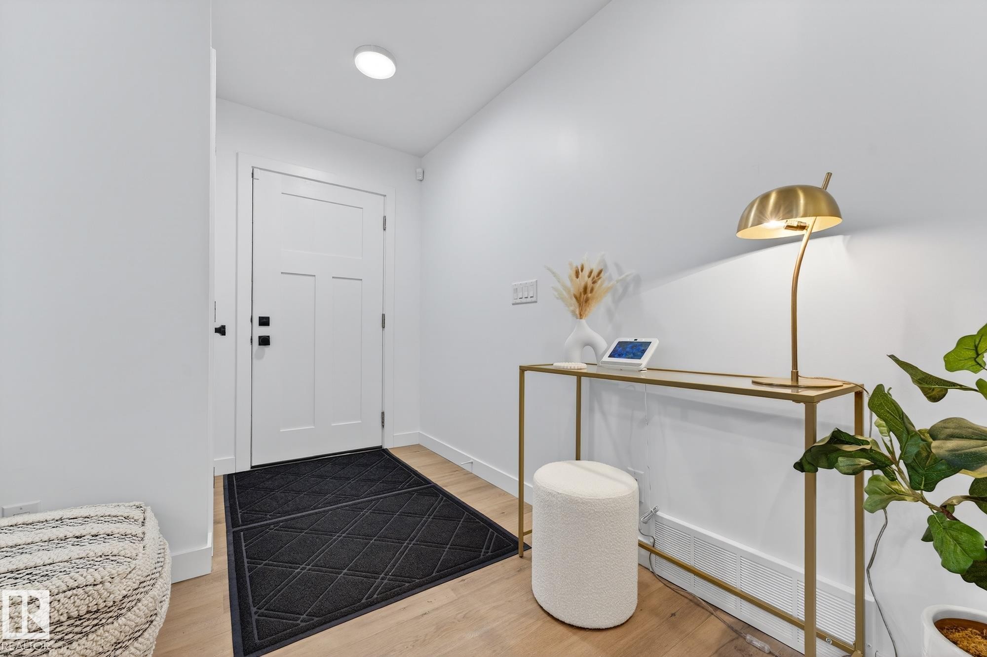 Foyer entrance with light wood finished floors - 8604 142 Street, Edmonton, AB - Indoor Photo Showing Other Room