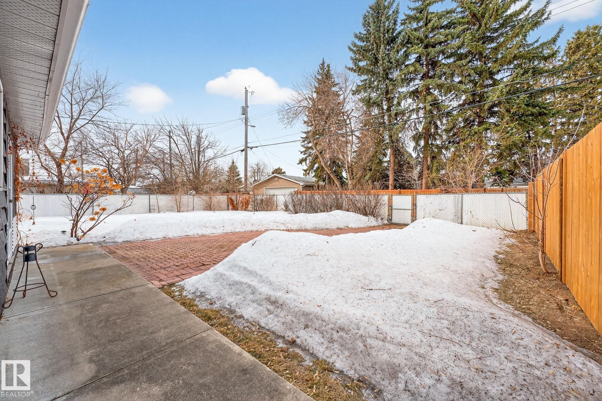 Yard layered in snow featuring a fenced backyard - 8604 142 Street, Edmonton, AB - Outdoor