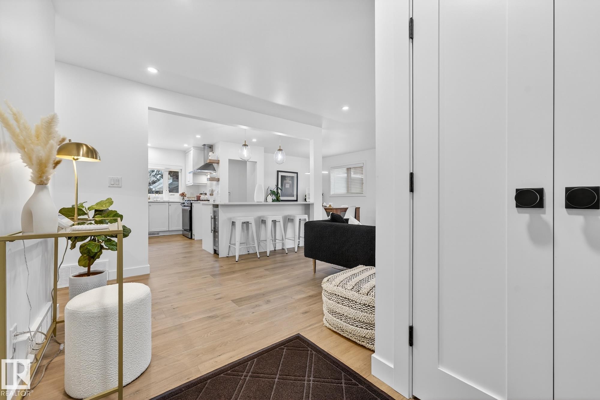 Hall with light wood-type flooring and recessed lighting - 8604 142 Street, Edmonton, AB - Indoor Photo Showing Other Room