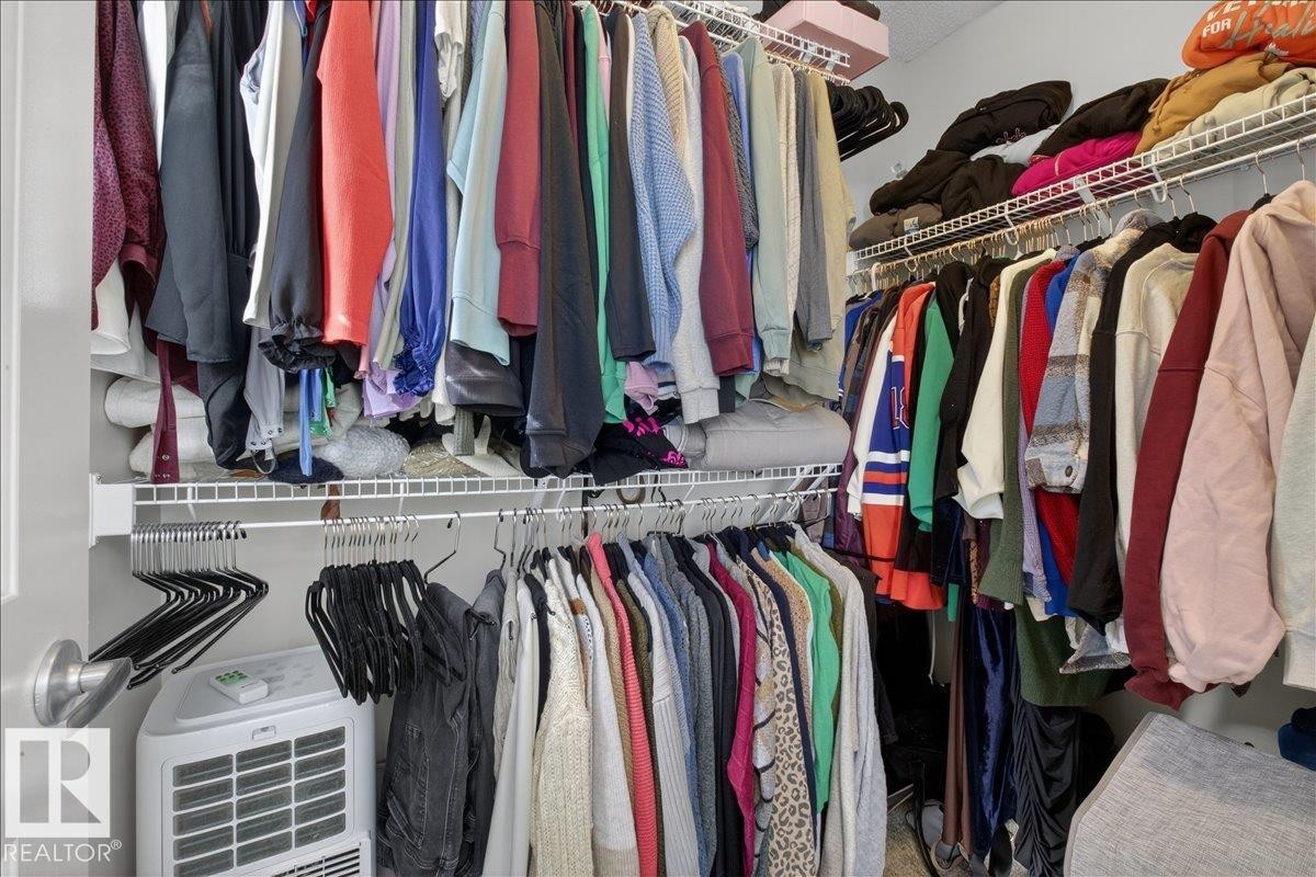 The property features a closet with white wire shelving and hanging rods - 9034 Rosenthal Link, Edmonton, AB - Indoor With Storage