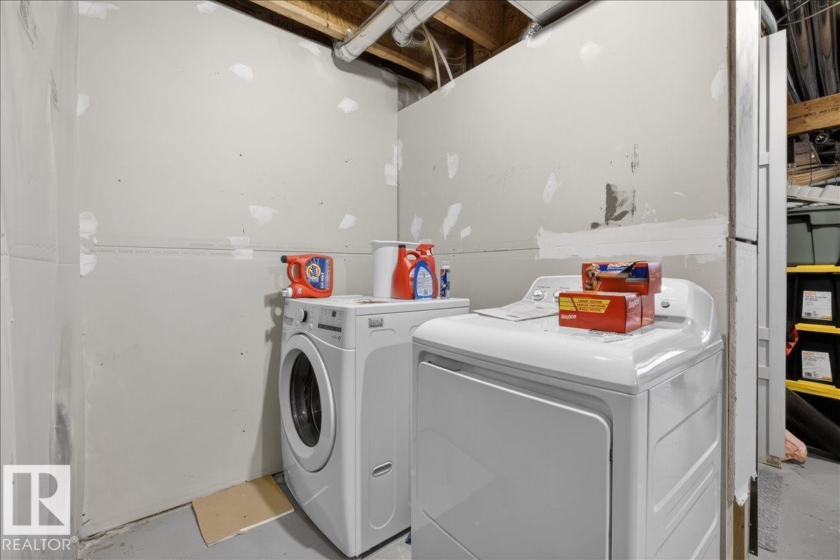 Utility area featuring a washing machine and dryer - 9034 Rosenthal Link, Edmonton, AB - Indoor Photo Showing Laundry Room