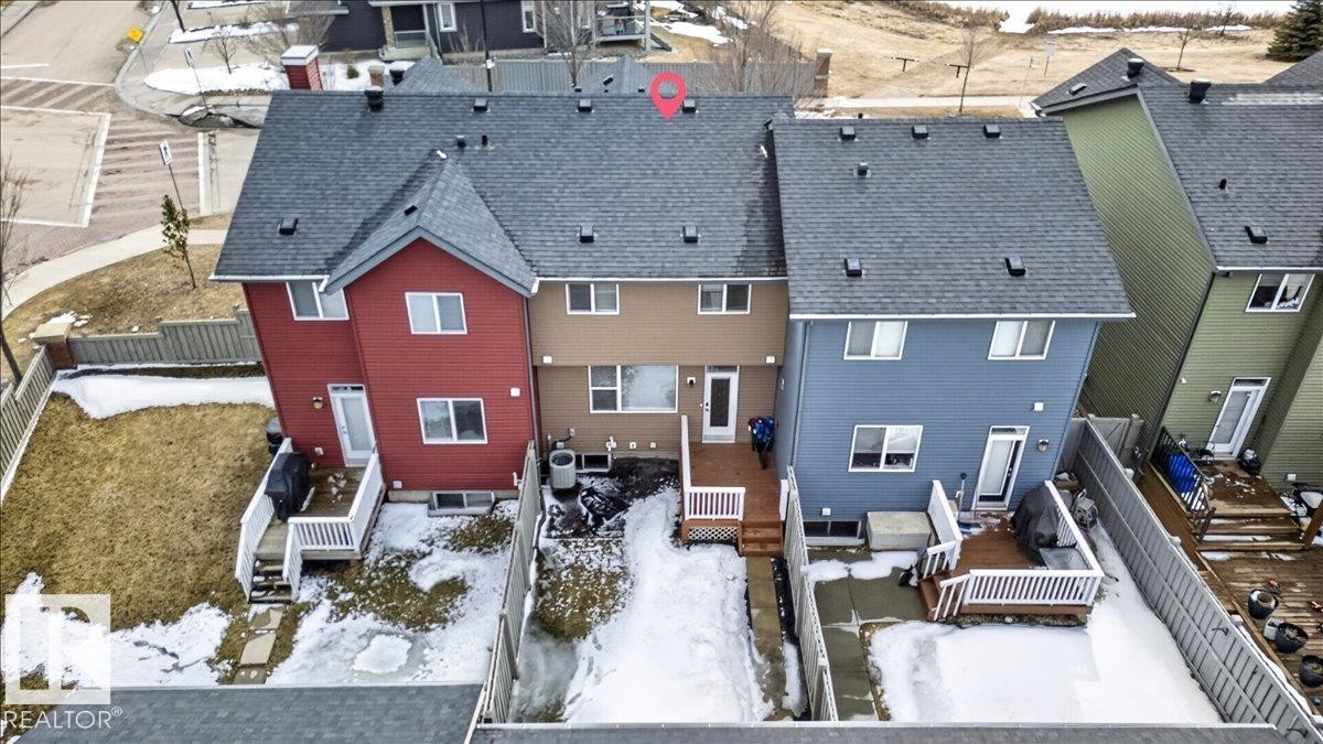 The property features a private fenced yard with a deck and direct access to the interior - 9034 Rosenthal Link, Edmonton, AB - Outdoor