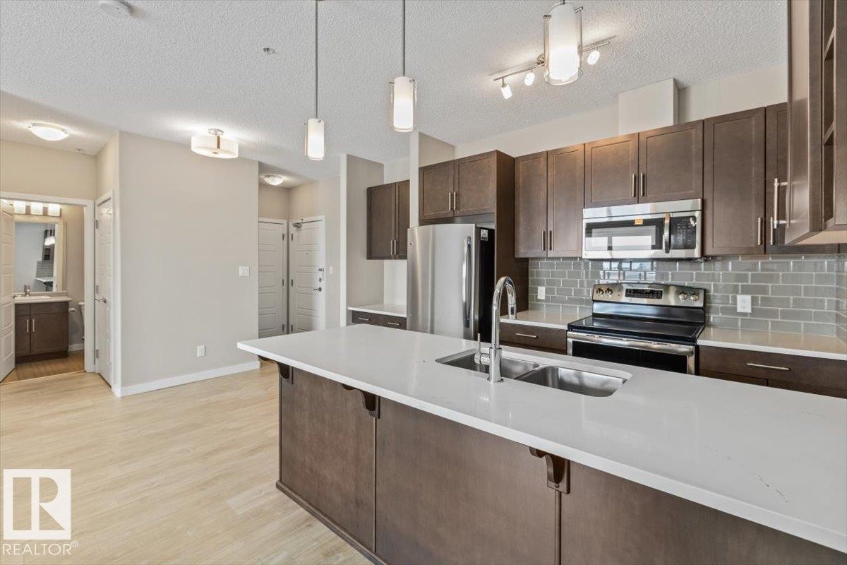 412 320 Ambleside Link Link, Edmonton, AB - Indoor Photo Showing Kitchen With Stainless Steel Kitchen With Double Sink With Upgraded Kitchen