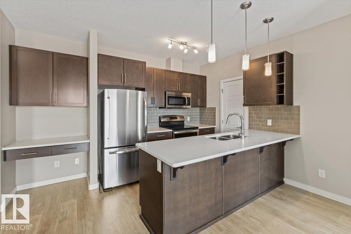 412 320 Ambleside Link Link, Edmonton, AB - Indoor Photo Showing Kitchen With Stainless Steel Kitchen With Double Sink With Upgraded Kitchen