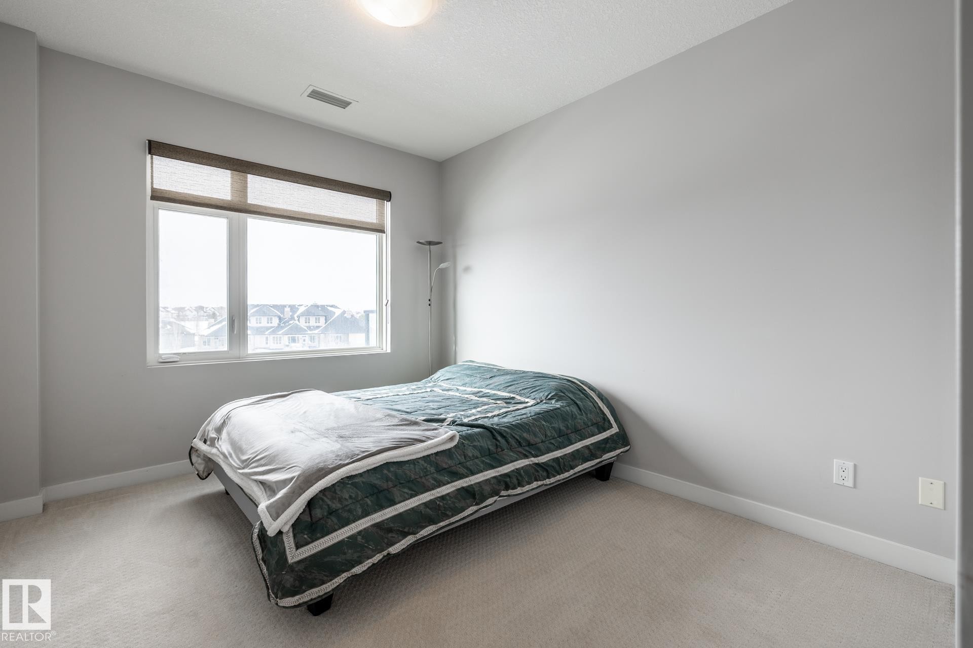 325 5151 Windermere Boulevard, Edmonton, AB - Indoor Photo Showing Bedroom