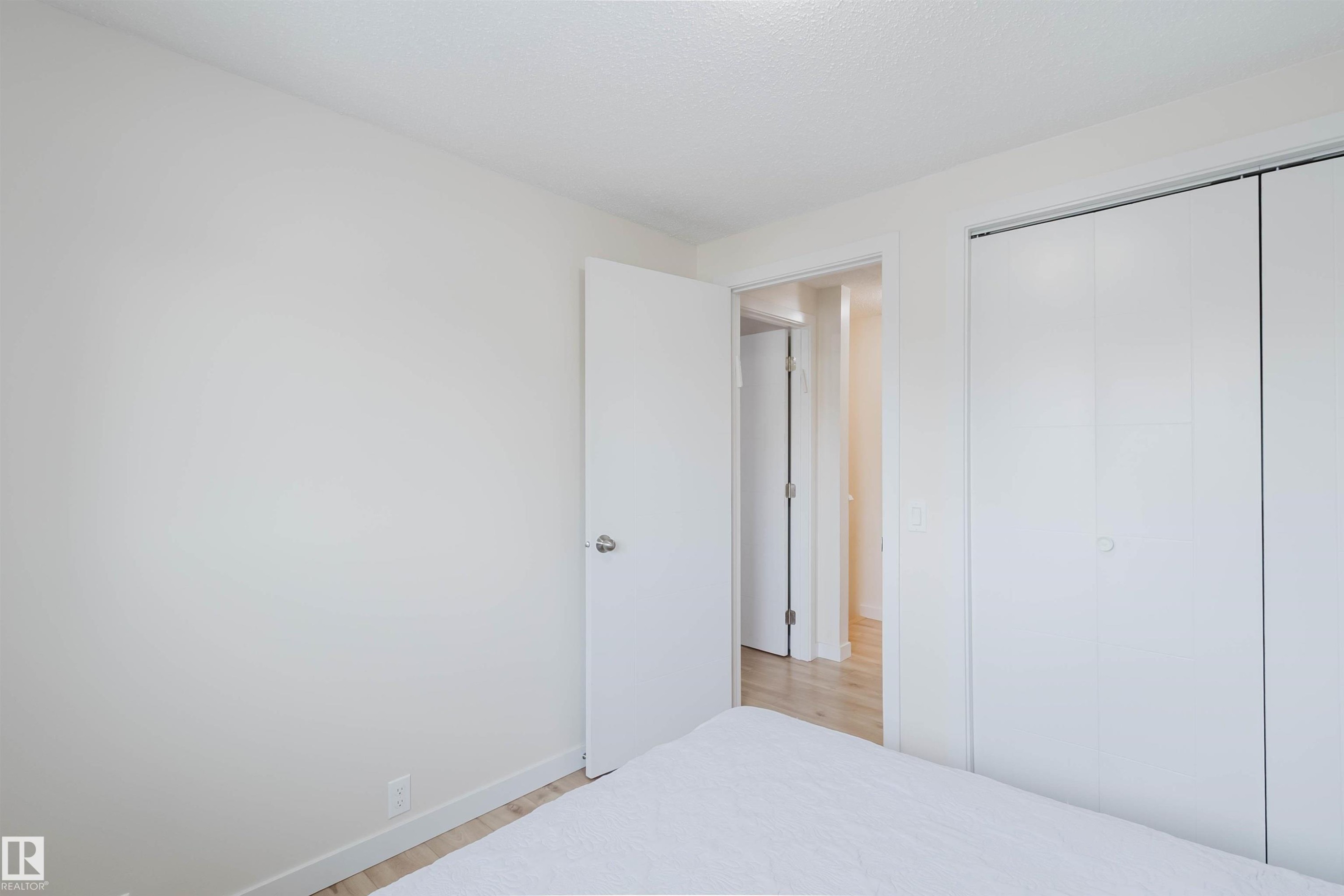 This room features light-colored walls and light-toned flooring, creating a bright and airy atmosphere - 18088 93 Avenue Nw, Edmonton, AB - Indoor Photo Showing Bedroom