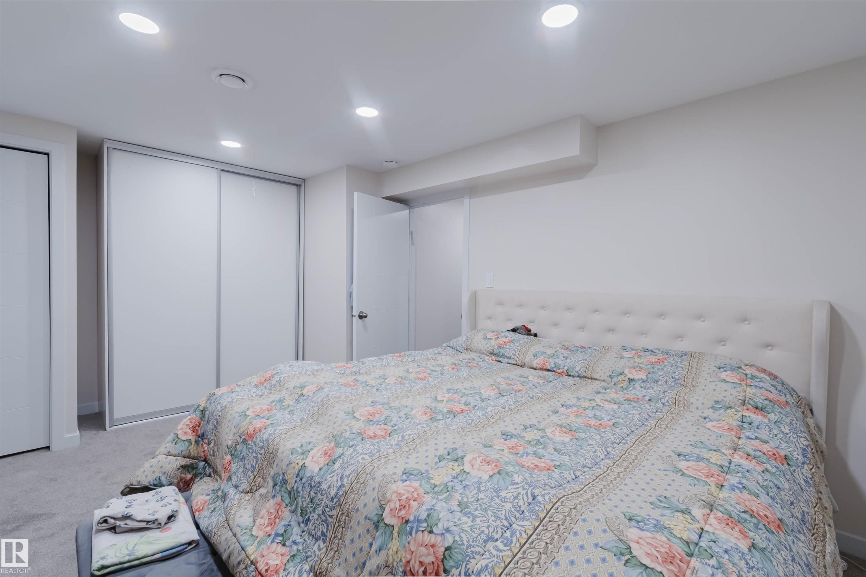This room features recessed lighting, white walls, and a light-colored carpet - 18088 93 Avenue Nw, Edmonton, AB - Indoor Photo Showing Bedroom