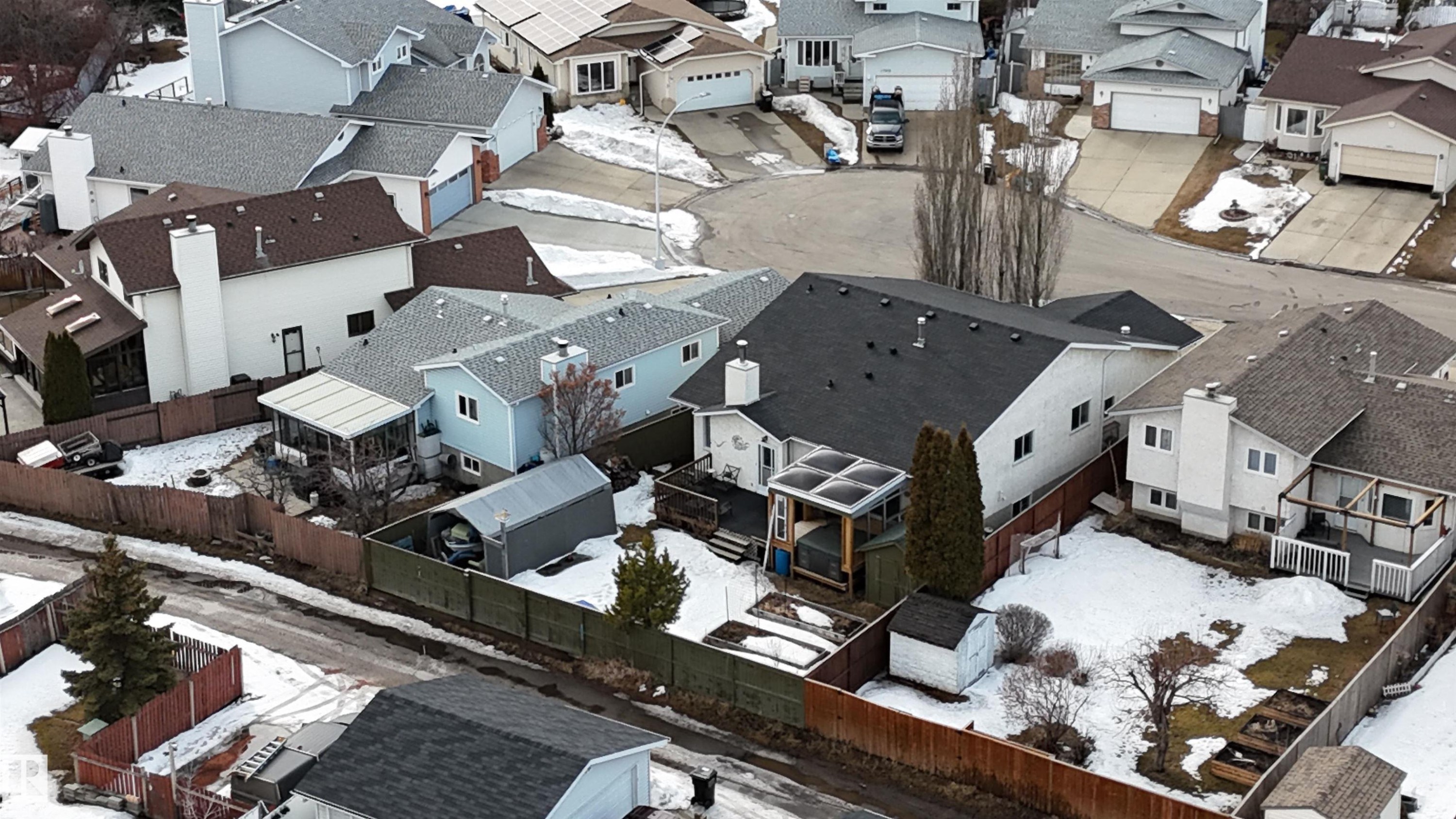 The property offers a sizable backyard with a shed and a deck - 17819 91A Street, Edmonton, AB - Outdoor