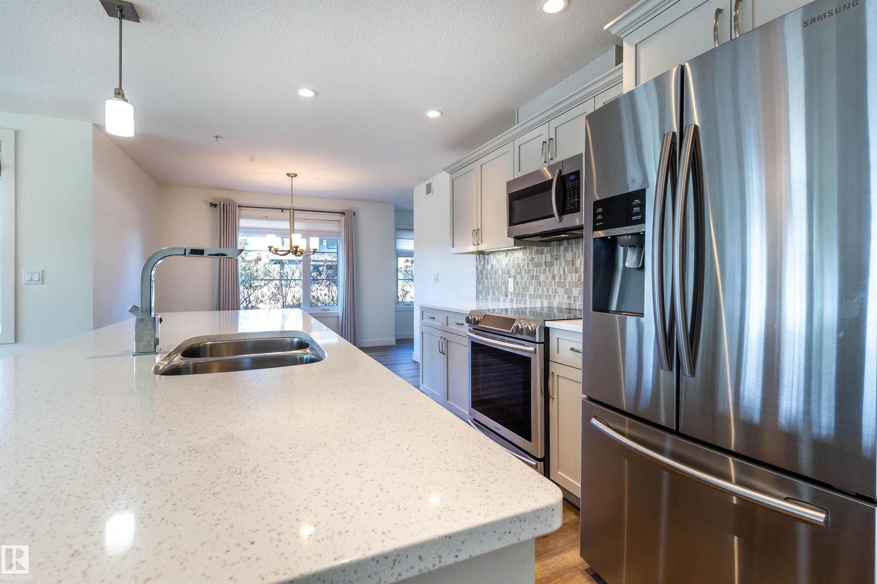 108 5025 Edgemont Boulevard, Edmonton, AB - Indoor Photo Showing Kitchen With Double Sink With Upgraded Kitchen