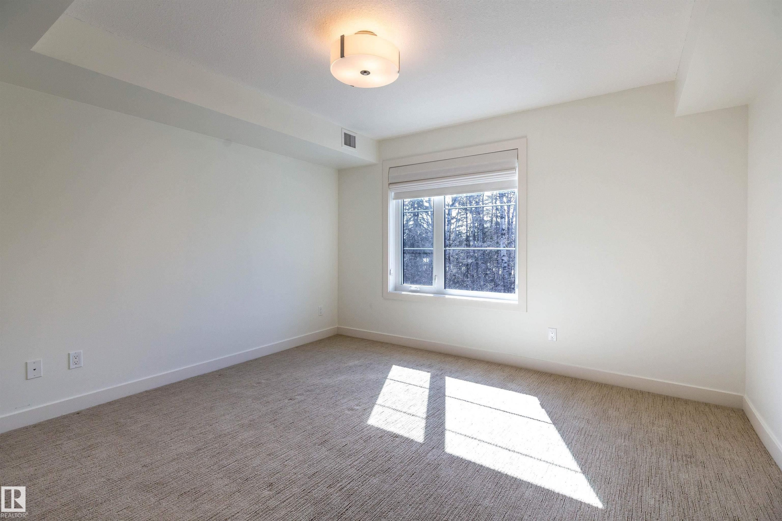 108 5025 Edgemont Boulevard, Edmonton, AB - Indoor Photo Showing Other Room