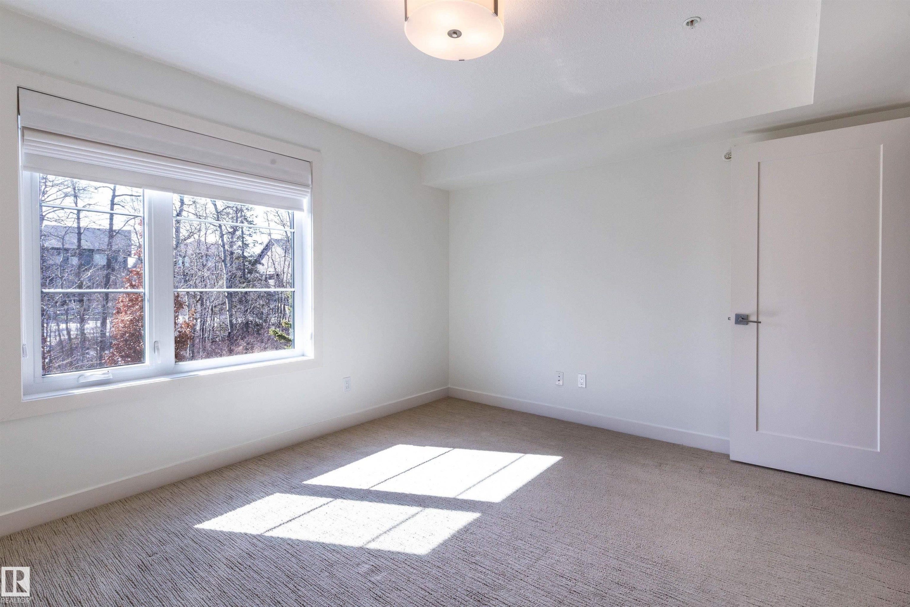 108 5025 Edgemont Boulevard, Edmonton, AB - Indoor Photo Showing Other Room