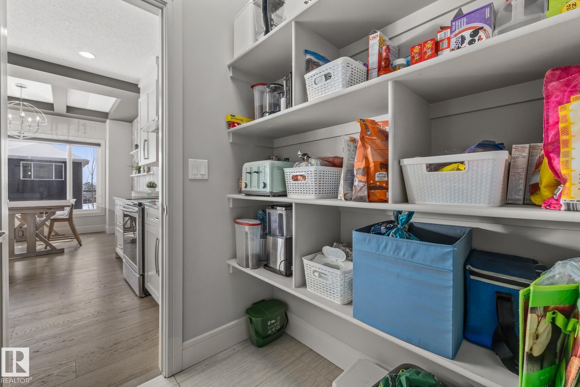 Well-organized pantry featuring extensive shelving, providing ample storage - 3864 Robins Crescent, Edmonton, AB - Indoor Photo Showing Other Room