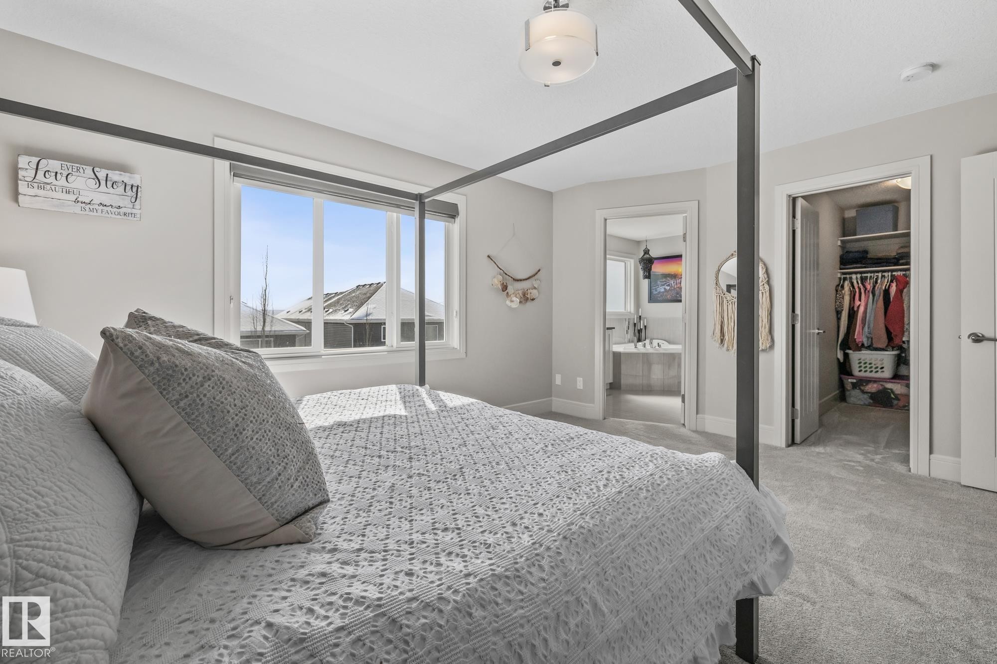 The bedroom features light-colored walls and grey carpeting, creating a neutral and inviting atmosphere - 3864 Robins Crescent, Edmonton, AB - Indoor Photo Showing Bedroom