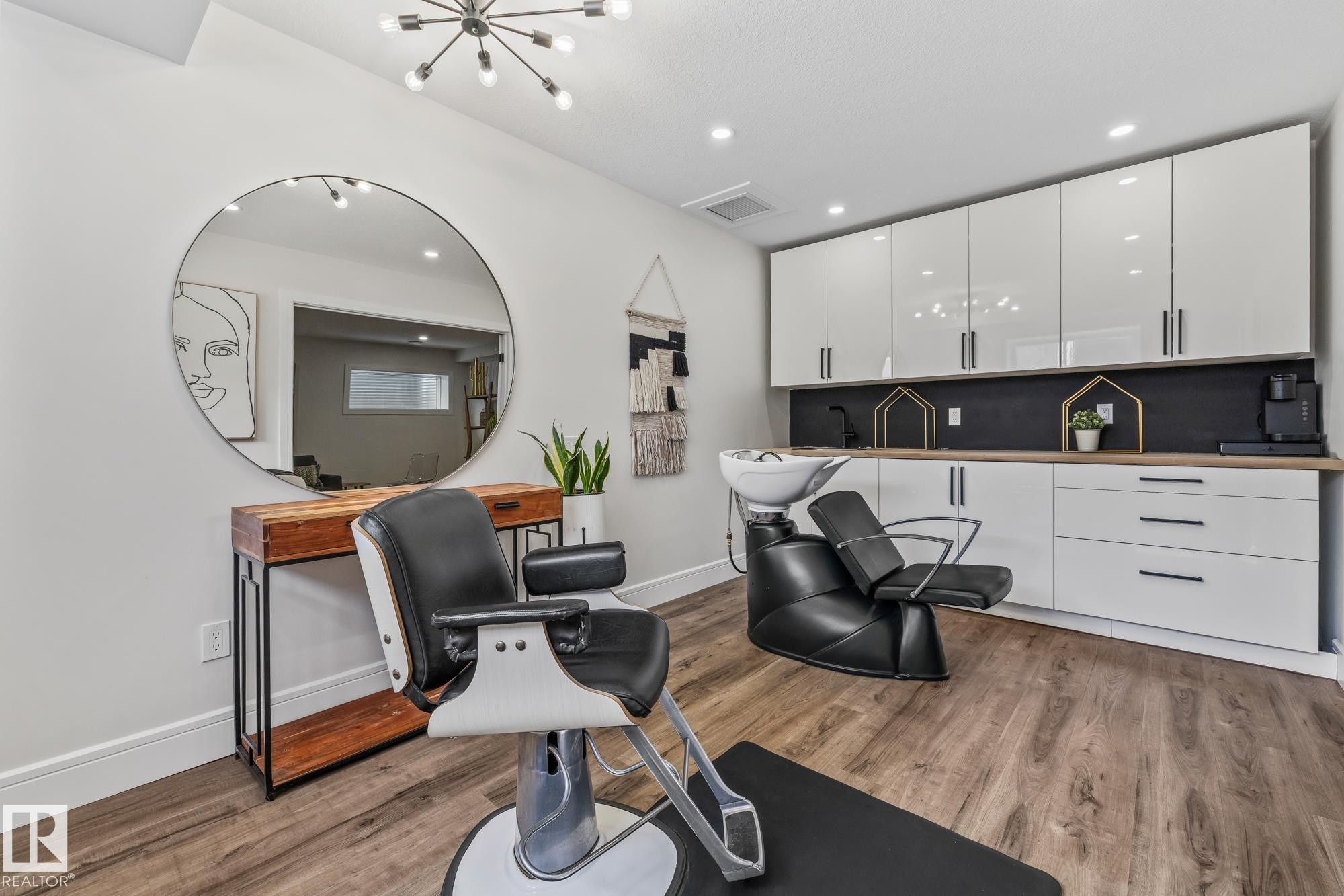 Versatile interior space featuring wood-look flooring, recessed lighting, and a modern light fixture - 3864 Robins Crescent, Edmonton, AB - Indoor Photo Showing Office
