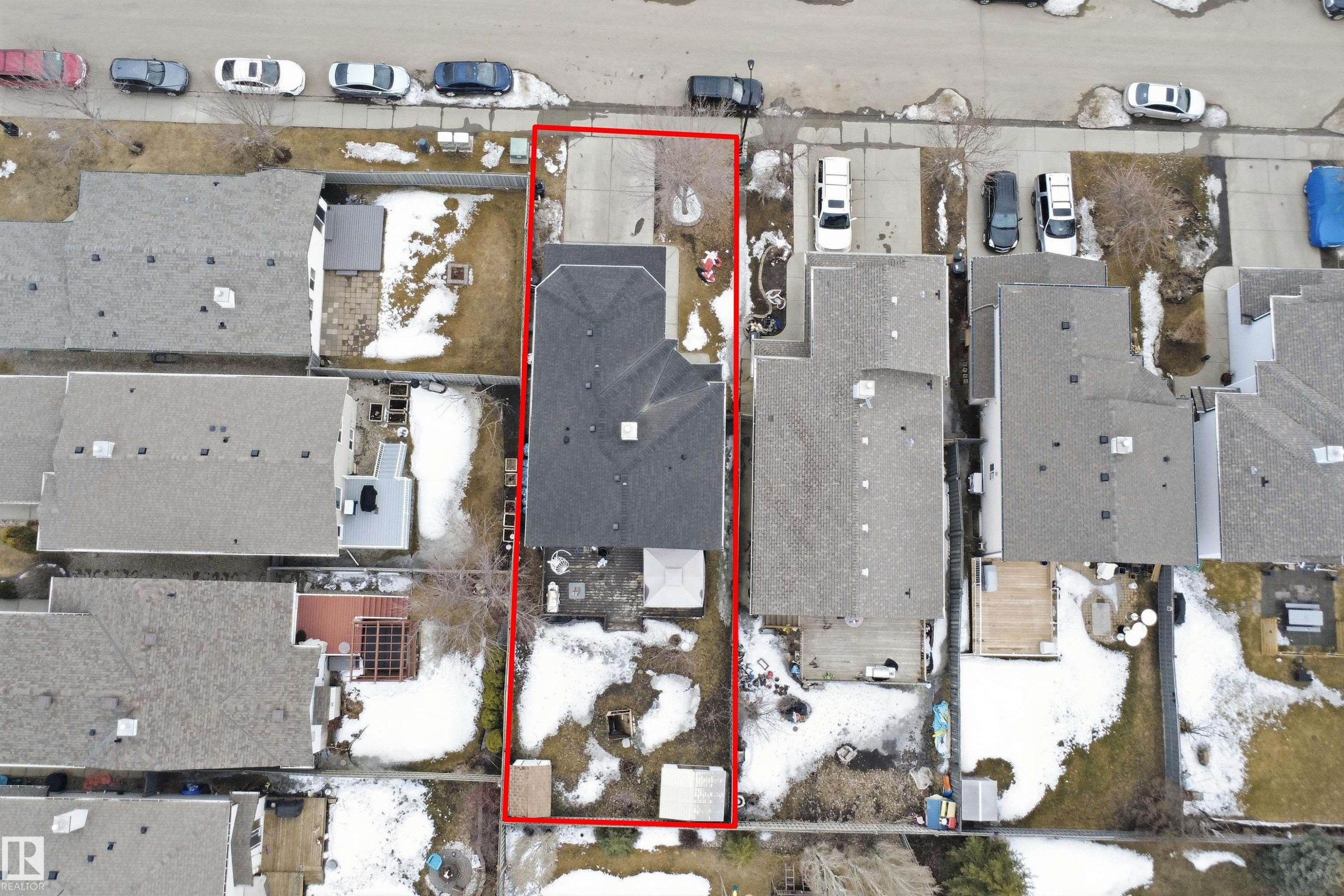 Aerial view of the property, featuring a paved driveway, a dark shingled roof, and a yard space - 4619 202 Street, Edmonton, AB - Other