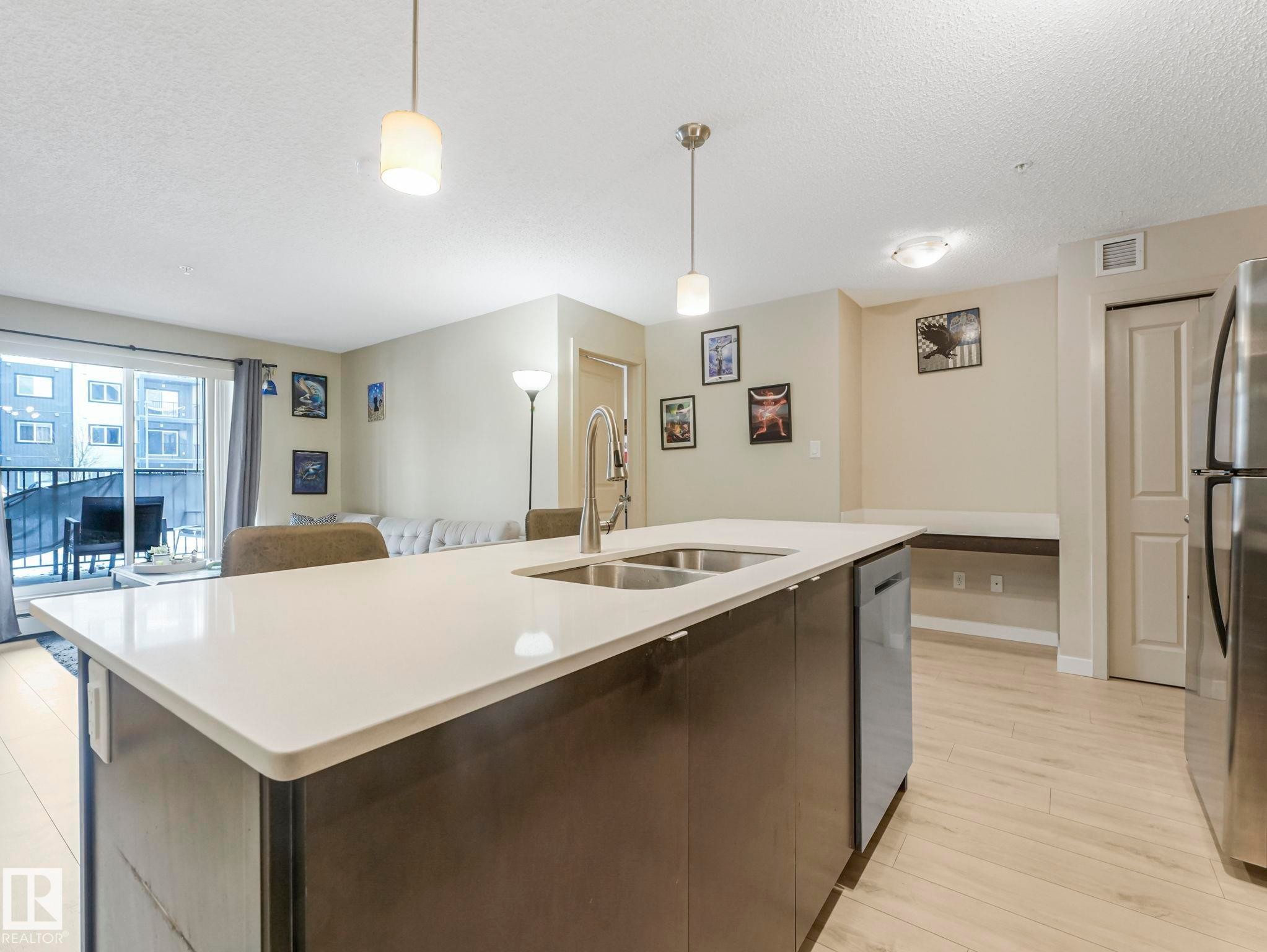 110 508 Albany Way, Edmonton, AB - Indoor Photo Showing Kitchen With Double Sink
