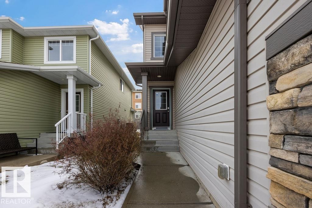 Aerial view showcasing a developed neighborhood with residential properties, main roads, and open land areas - 7873 170A Avenue, Edmonton, AB - Outdoor With View