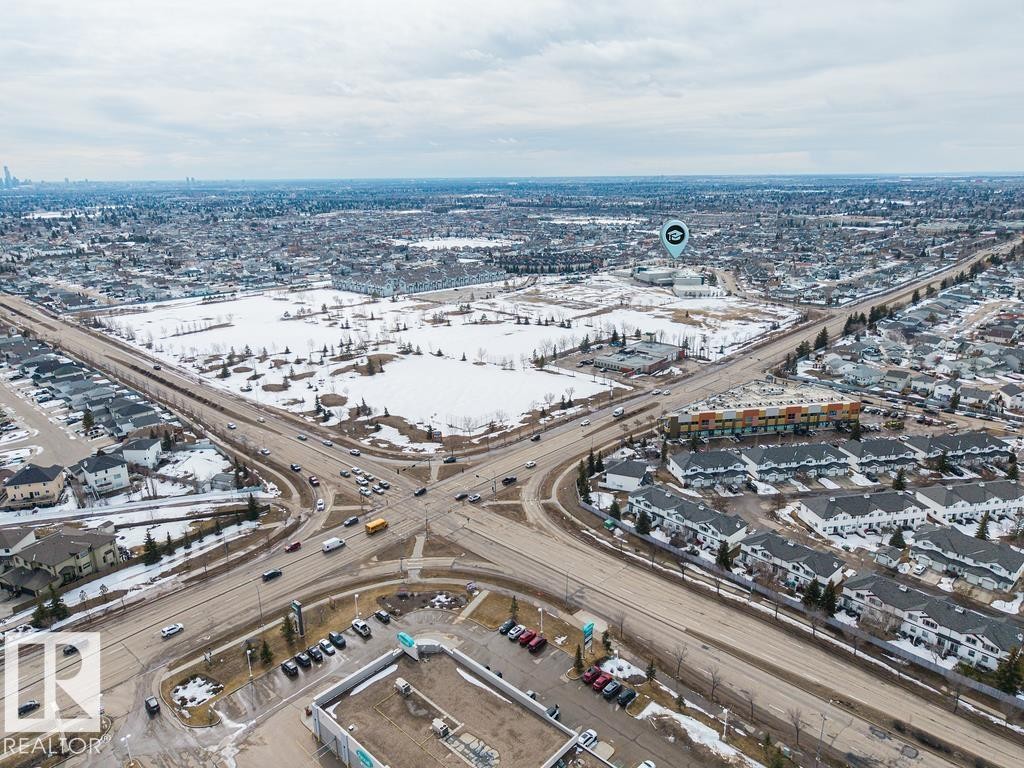 Expansive aerial perspective showcasing a residential development with diverse housing styles - 7873 170A Avenue, Edmonton, AB - Outdoor With View