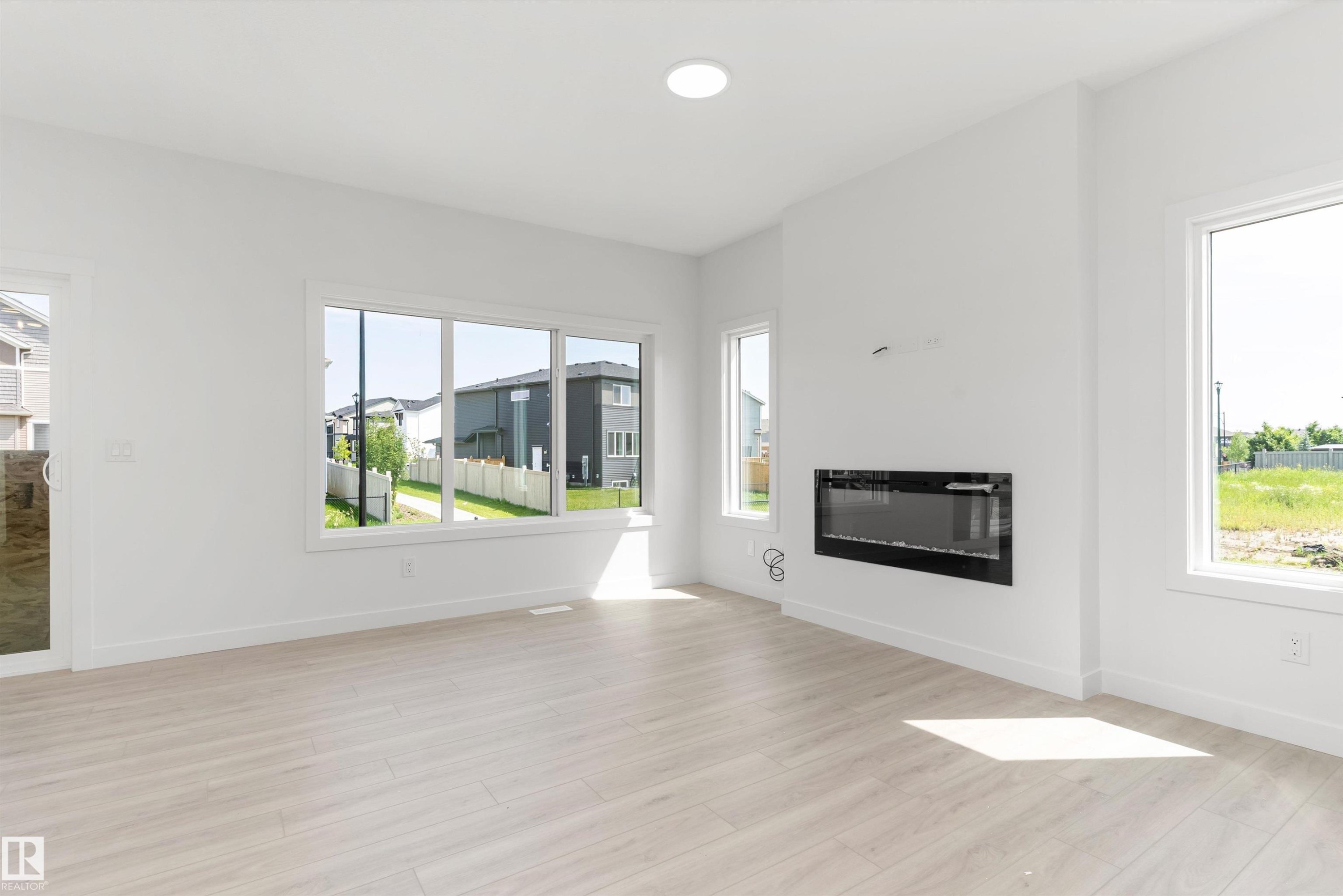 5047 Cawsey Link Sw, Edmonton, AB - Indoor Photo Showing Living Room With Fireplace