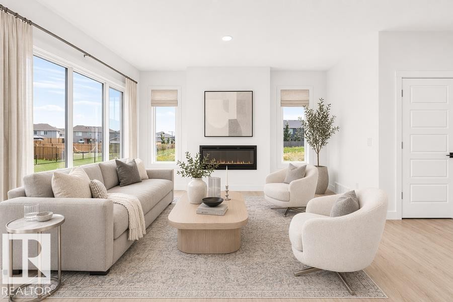 5047 Cawsey Link Sw, Edmonton, AB - Indoor Photo Showing Living Room With Fireplace