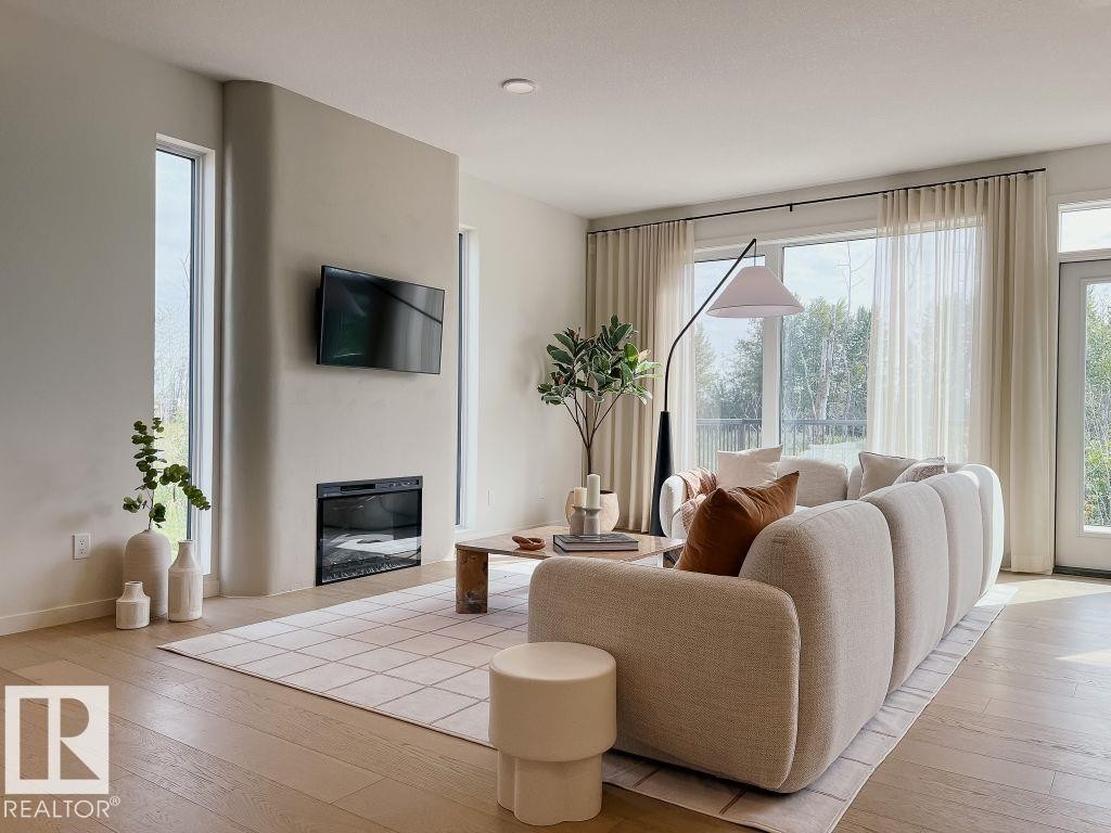 7017 50A Avenue, Beaumont, AB - Indoor Photo Showing Living Room With Fireplace