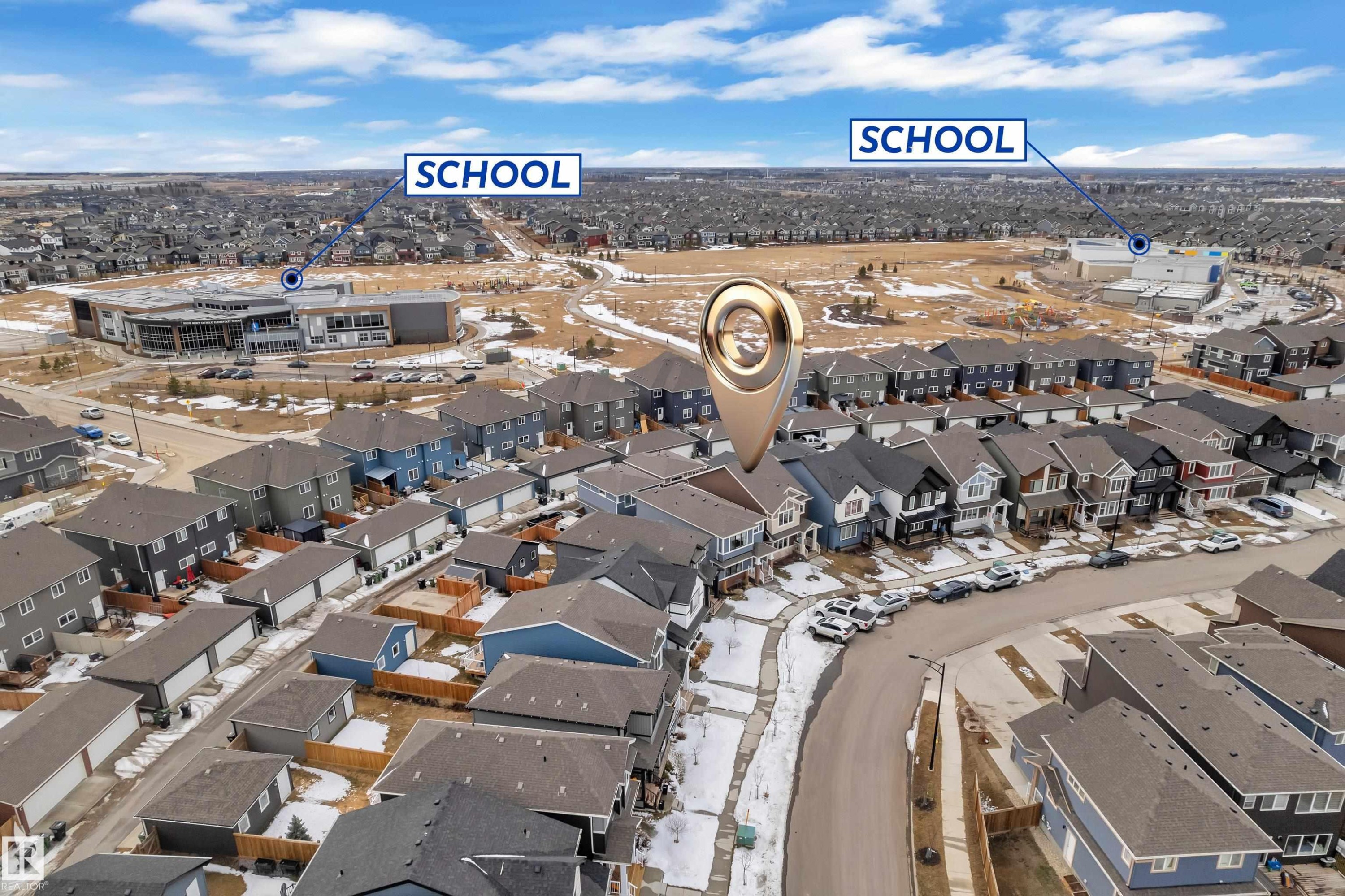 Aerial view of the neighborhood showcasing a residential street with properties and a nearby school building - 1645 Plum Circle, Edmonton, AB - Outdoor With View