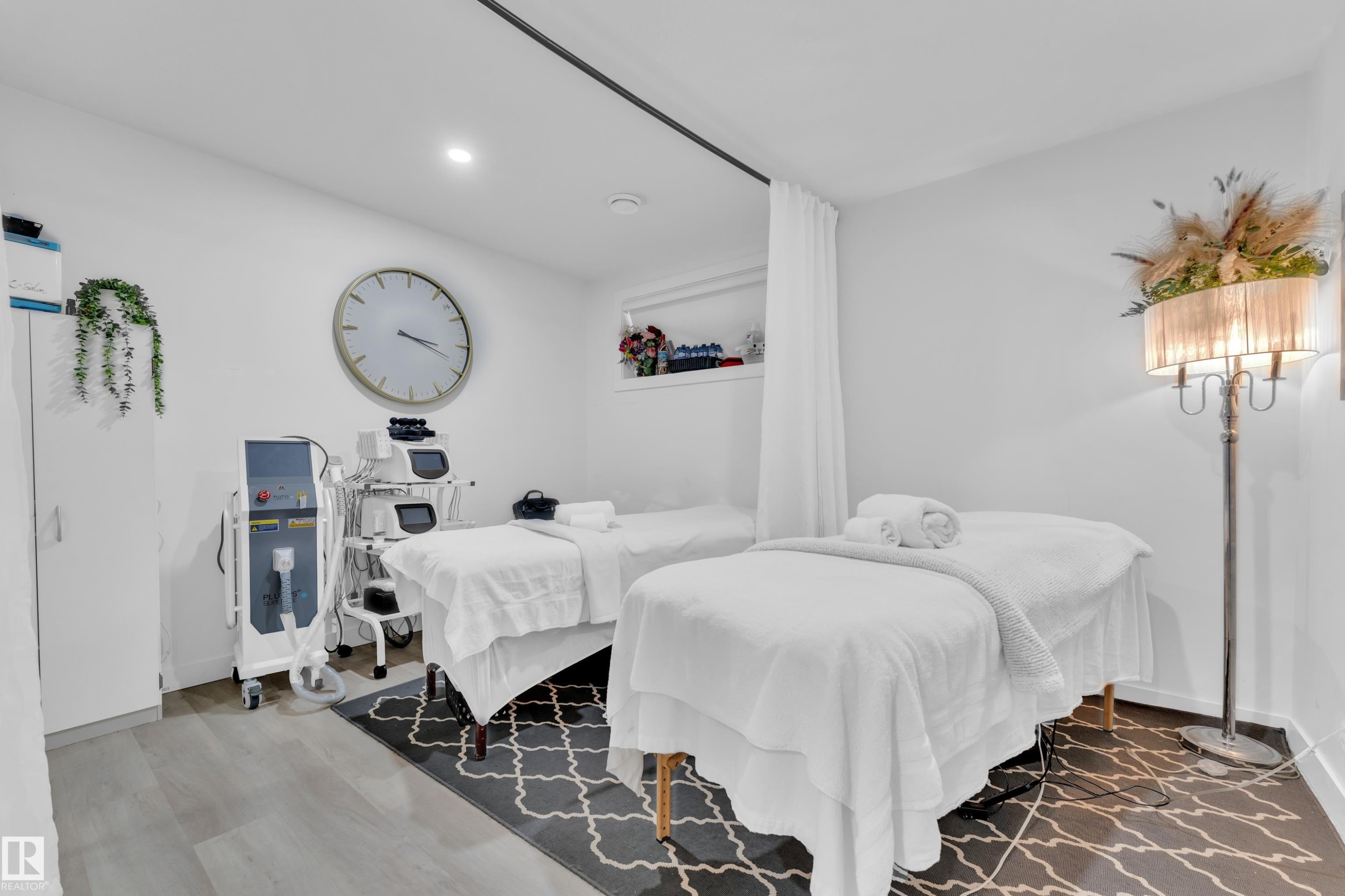 This room features light-colored flooring and white walls, creating a bright atmosphere - 1645 Plum Circle, Edmonton, AB - Indoor Photo Showing Bedroom