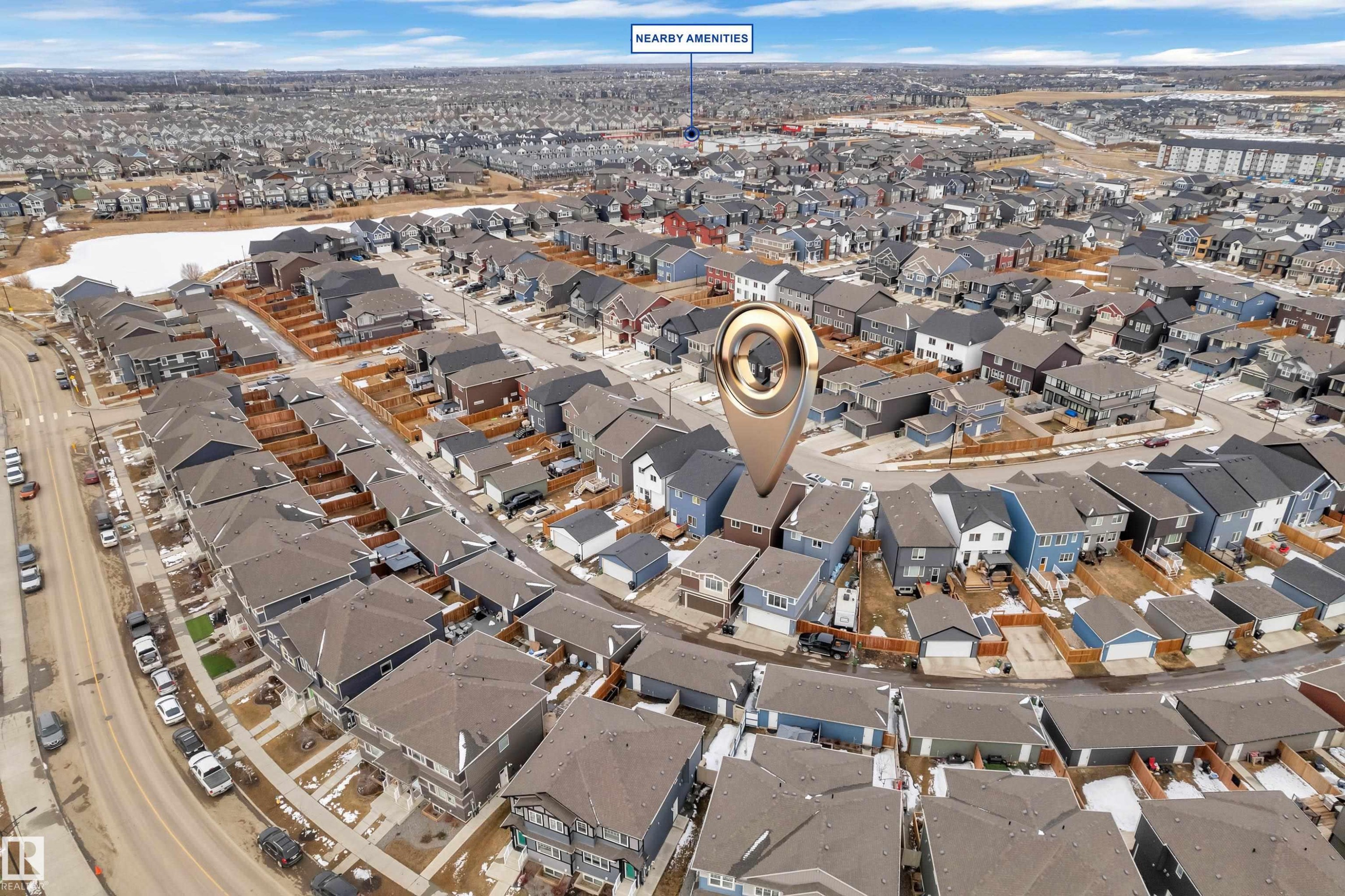 Aerial view of the neighborhood, showcasing houses with various roof styles and a nearby body of water - 1645 Plum Circle, Edmonton, AB - Outdoor With View