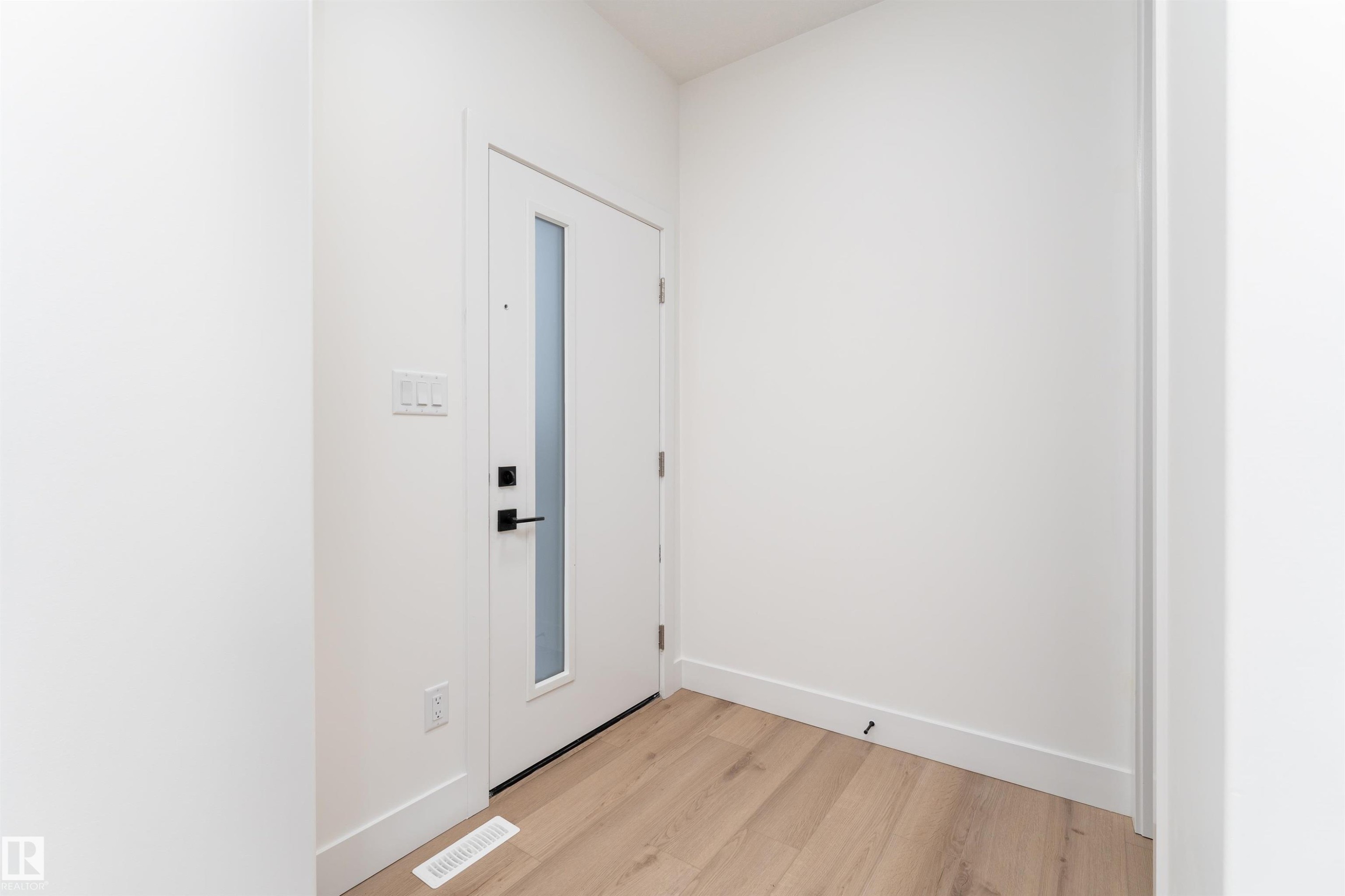Entryway with light wood finished floors and baseboards - 3109 Magpie Way, Edmonton, AB