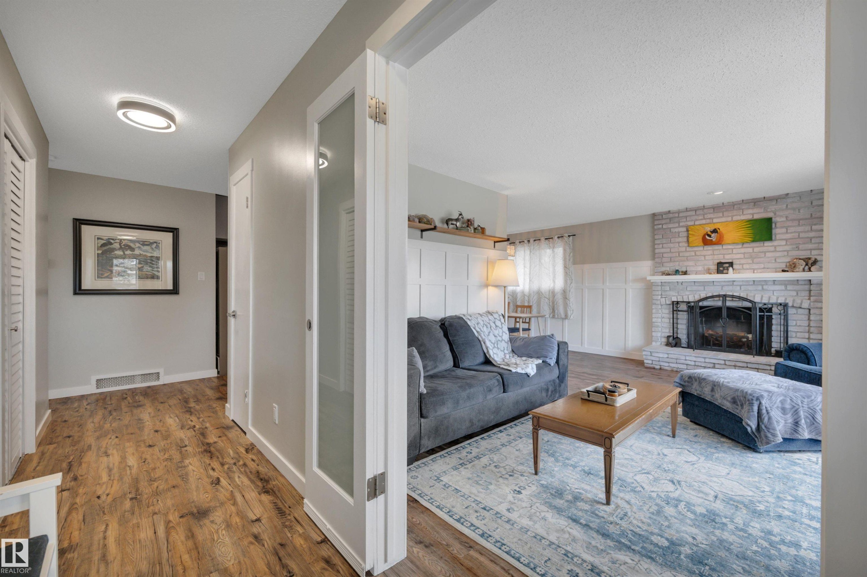 10435 39A Avenue, Edmonton, AB - Indoor Photo Showing Living Room With Fireplace
