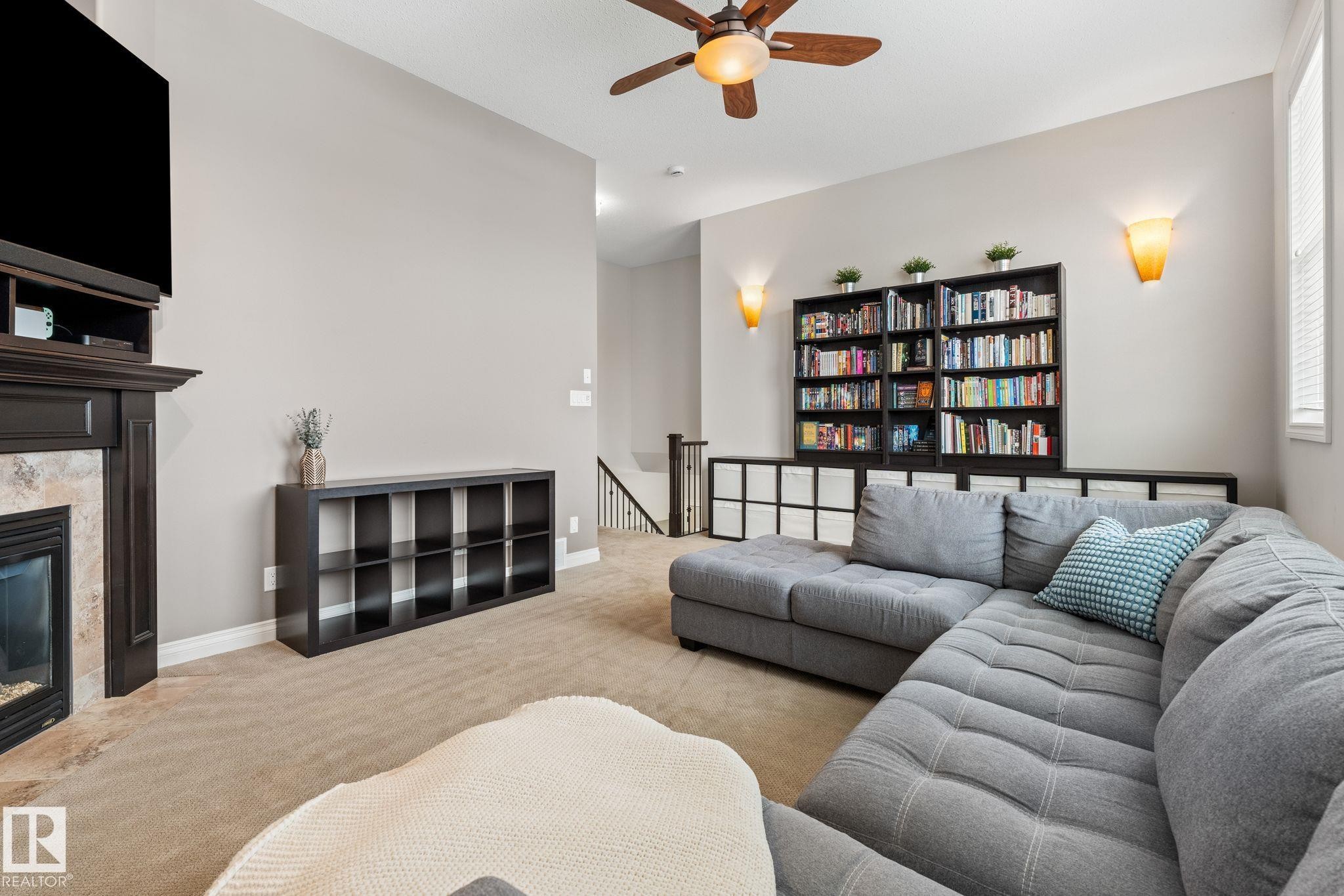 2 Longview Point(E), Spruce Grove, AB - Indoor Photo Showing Living Room With Fireplace