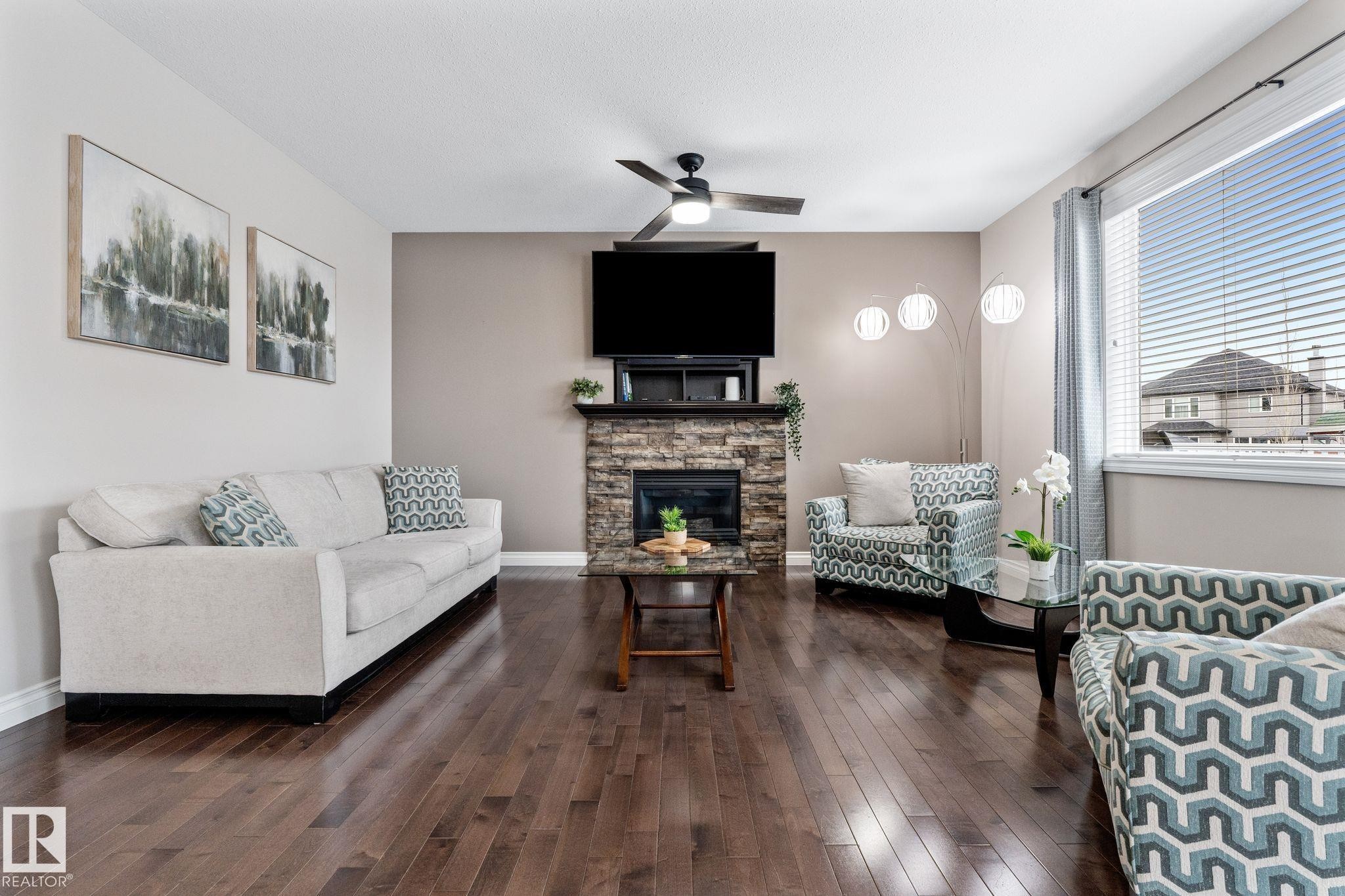 2 Longview Point(E), Spruce Grove, AB - Indoor Photo Showing Living Room With Fireplace