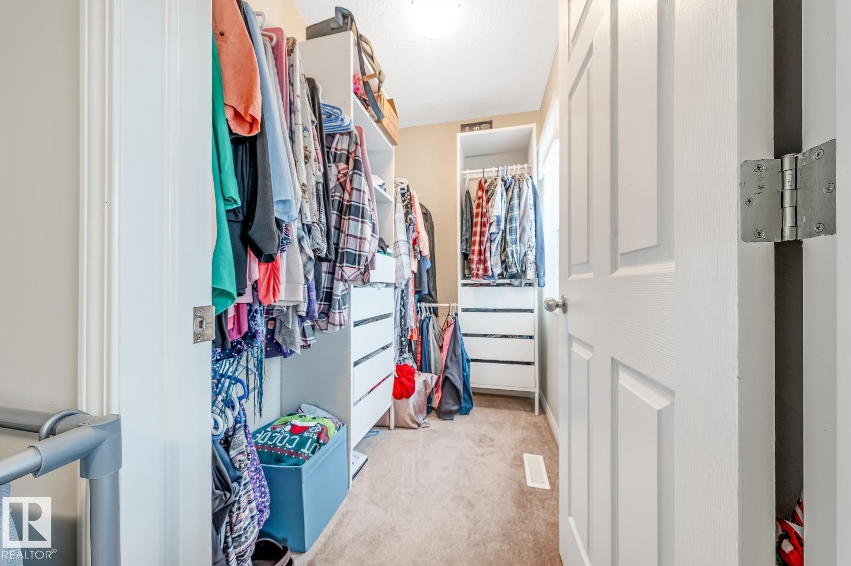 The property features a closet with built-in shelving and drawers, offering efficient storage solutions - 3109 Carpenter Landing, Edmonton, AB - Indoor With Storage
