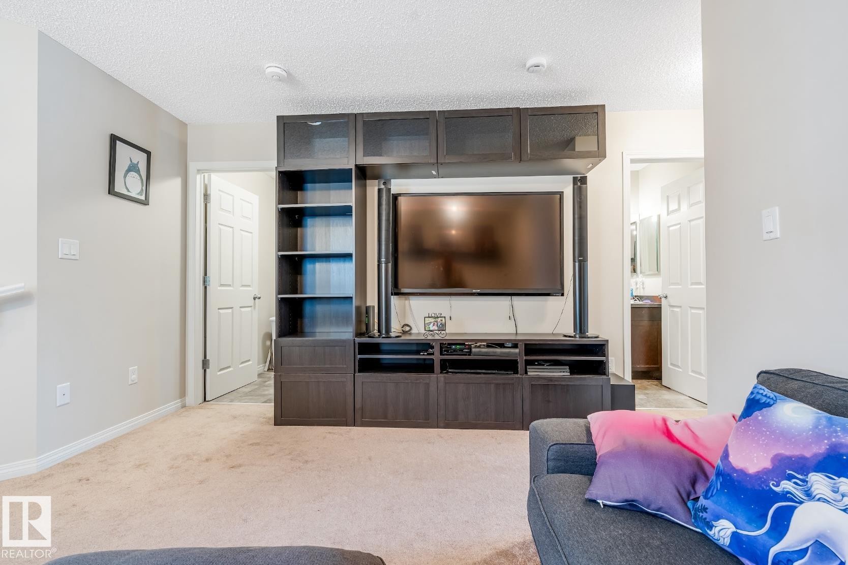 The property features light-colored walls and carpeted flooring, creating a neutral canvas - 3109 Carpenter Landing, Edmonton, AB - Indoor Photo Showing Other Room