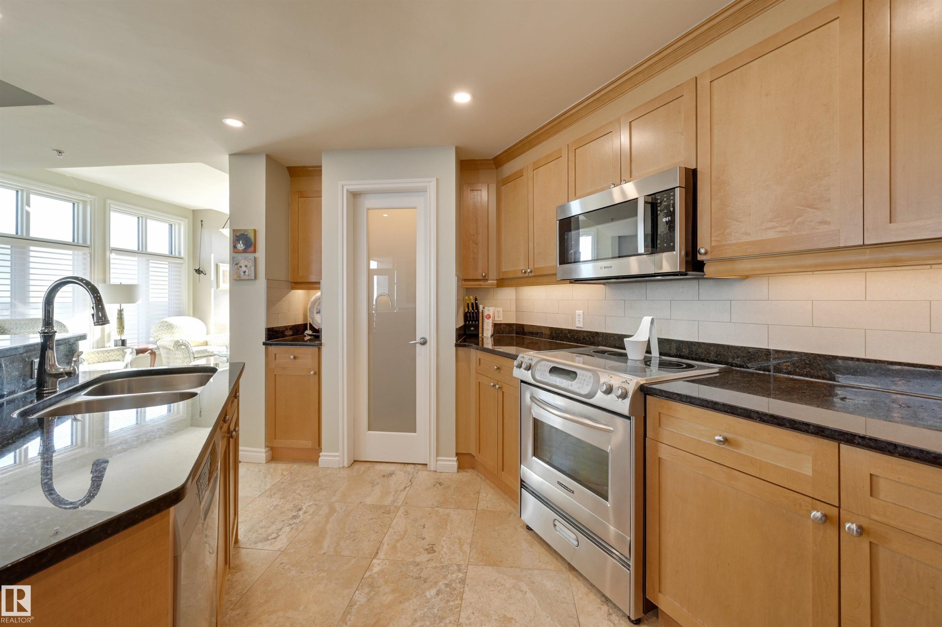 1003 9020 Jasper Avenue, Edmonton, AB - Indoor Photo Showing Kitchen With Double Sink