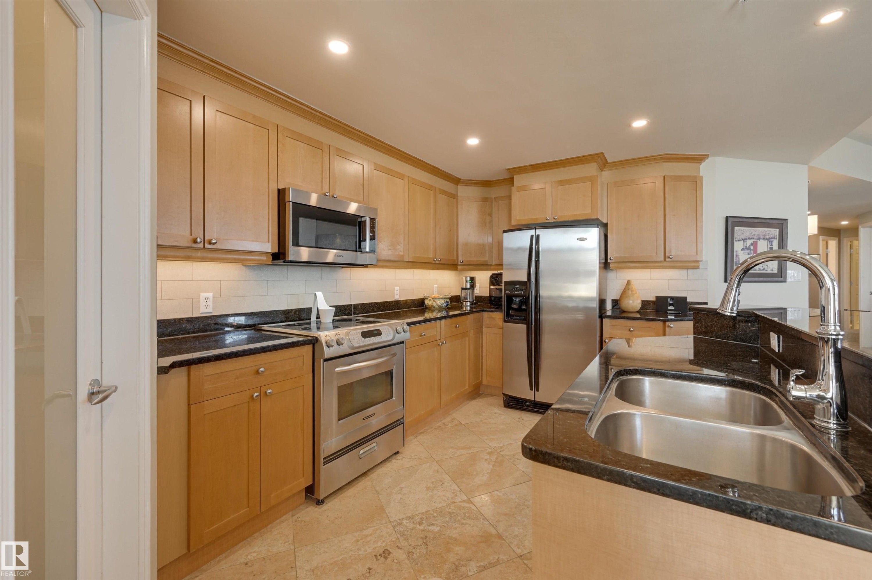 1003 9020 Jasper Avenue, Edmonton, AB - Indoor Photo Showing Kitchen With Double Sink