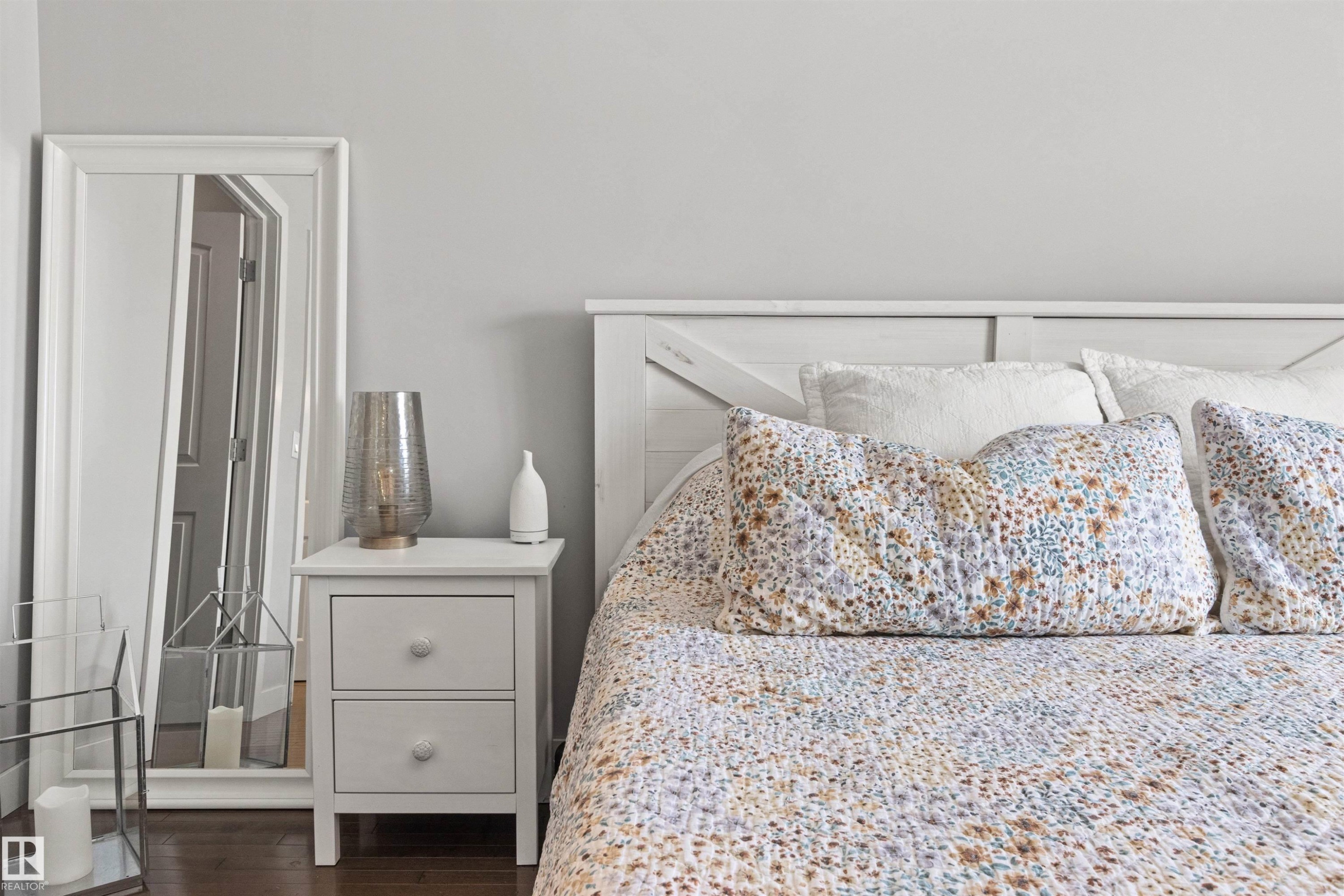 This bedroom features light gray walls and a white wooden headboard - 38 Hewitt Circle, Spruce Grove, AB - Indoor Photo Showing Bedroom