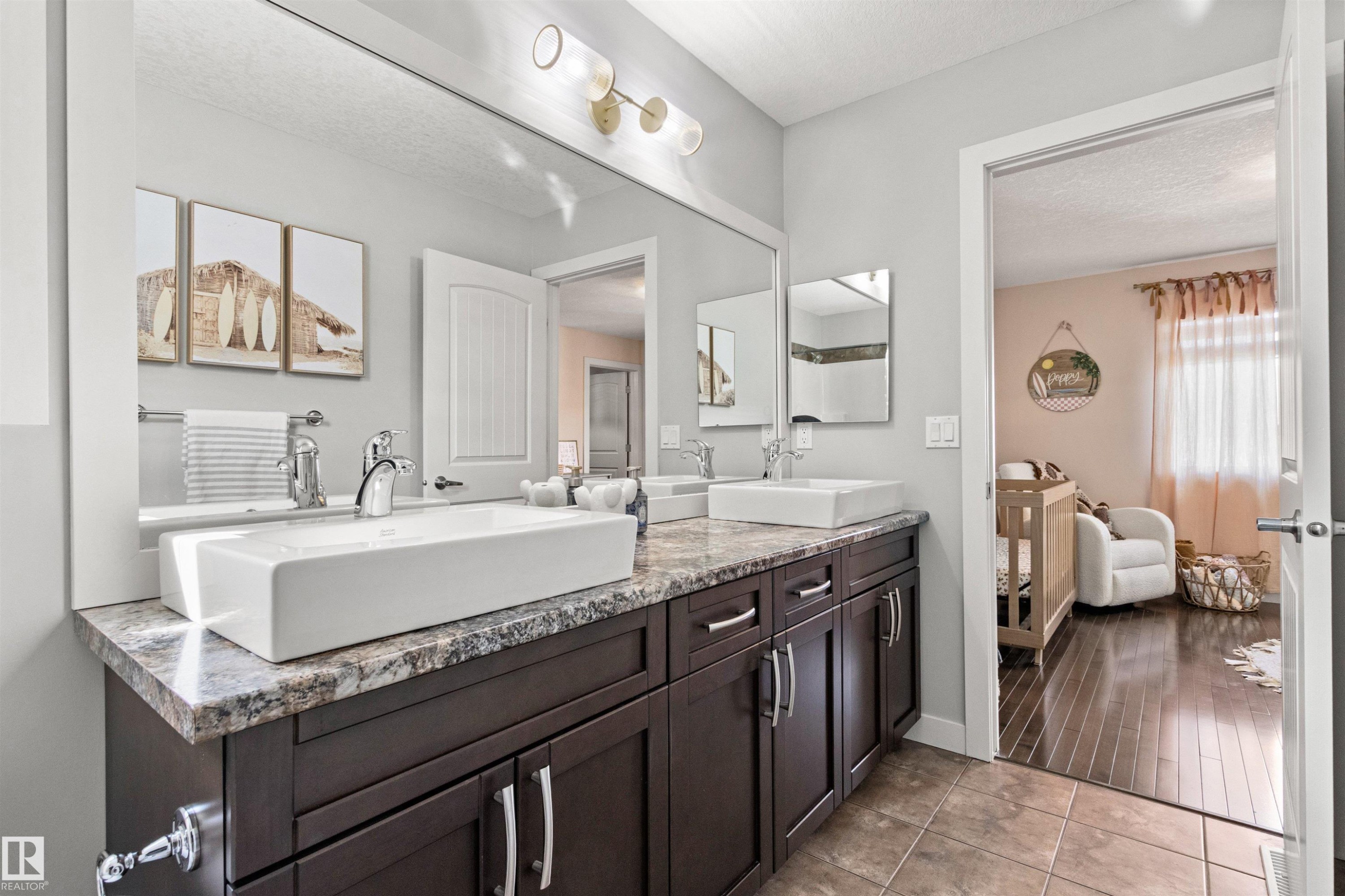 Bathroom with a vanity featuring two vessel sinks, a granite countertop, and dark wood cabinetry - 38 Hewitt Circle, Spruce Grove, AB - Indoor Photo Showing Bathroom