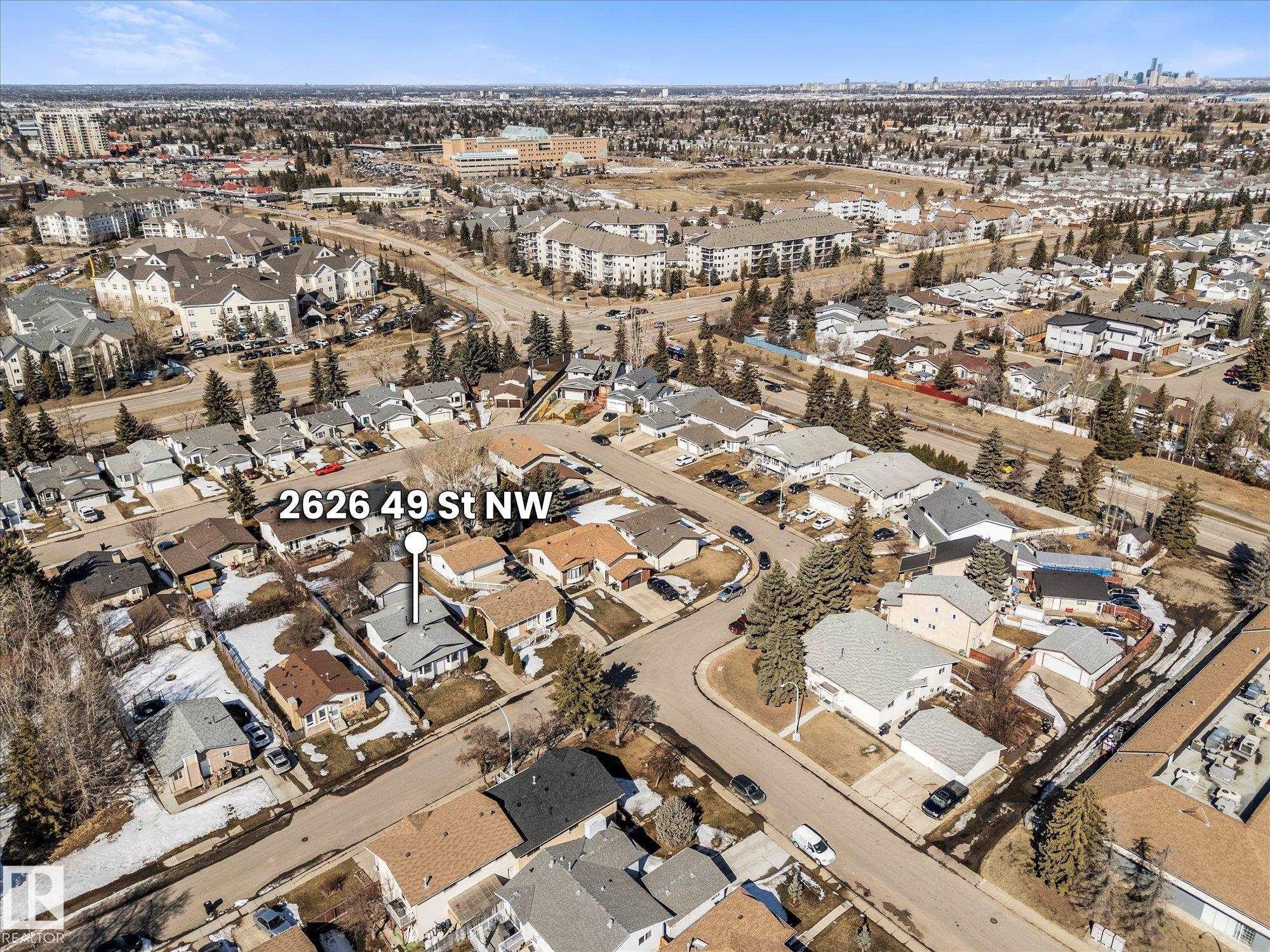 Aerial view of the property and its surrounding residential area, featuring nearby roads and other properties - 2626 49 Street, Edmonton, AB - Outdoor With View
