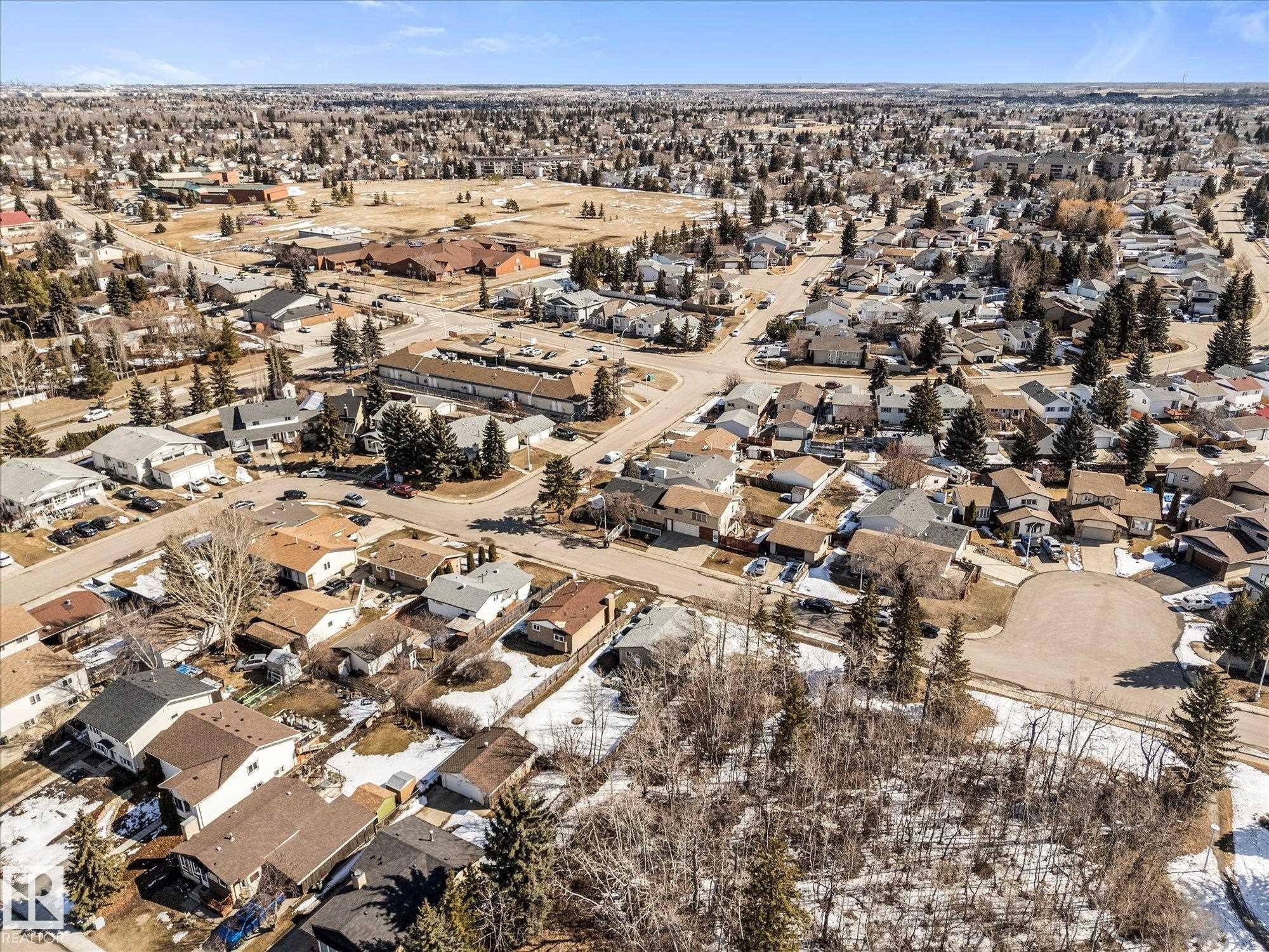 Aerial view of the neighborhood showcasing residential properties with varied roof styles and surrounding trees - 2626 49 Street, Edmonton, AB - Outdoor With View