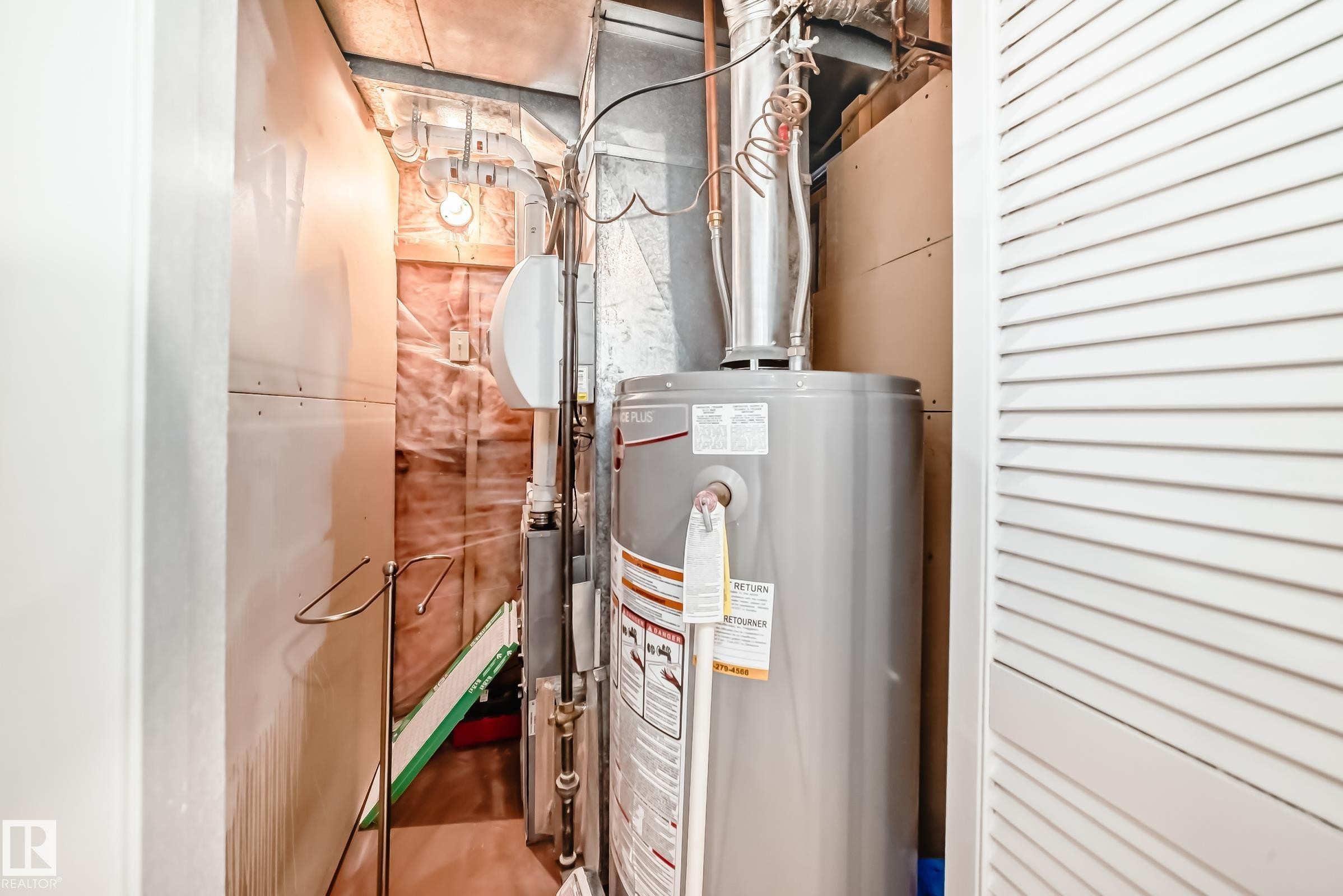The property includes a water heater and accessible utility space - 287 Lago Lindo Crescent, Edmonton, AB - Indoor Photo Showing Basement